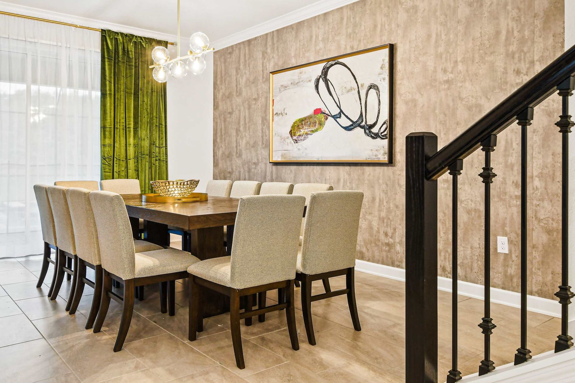 Stylish dining room with seating for 10, modern art, and elegant lighting