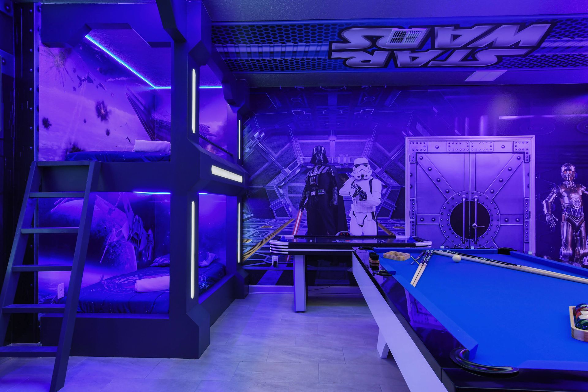Immersive Star Wars-themed room with custom bunk beds, pool, and air hockey
