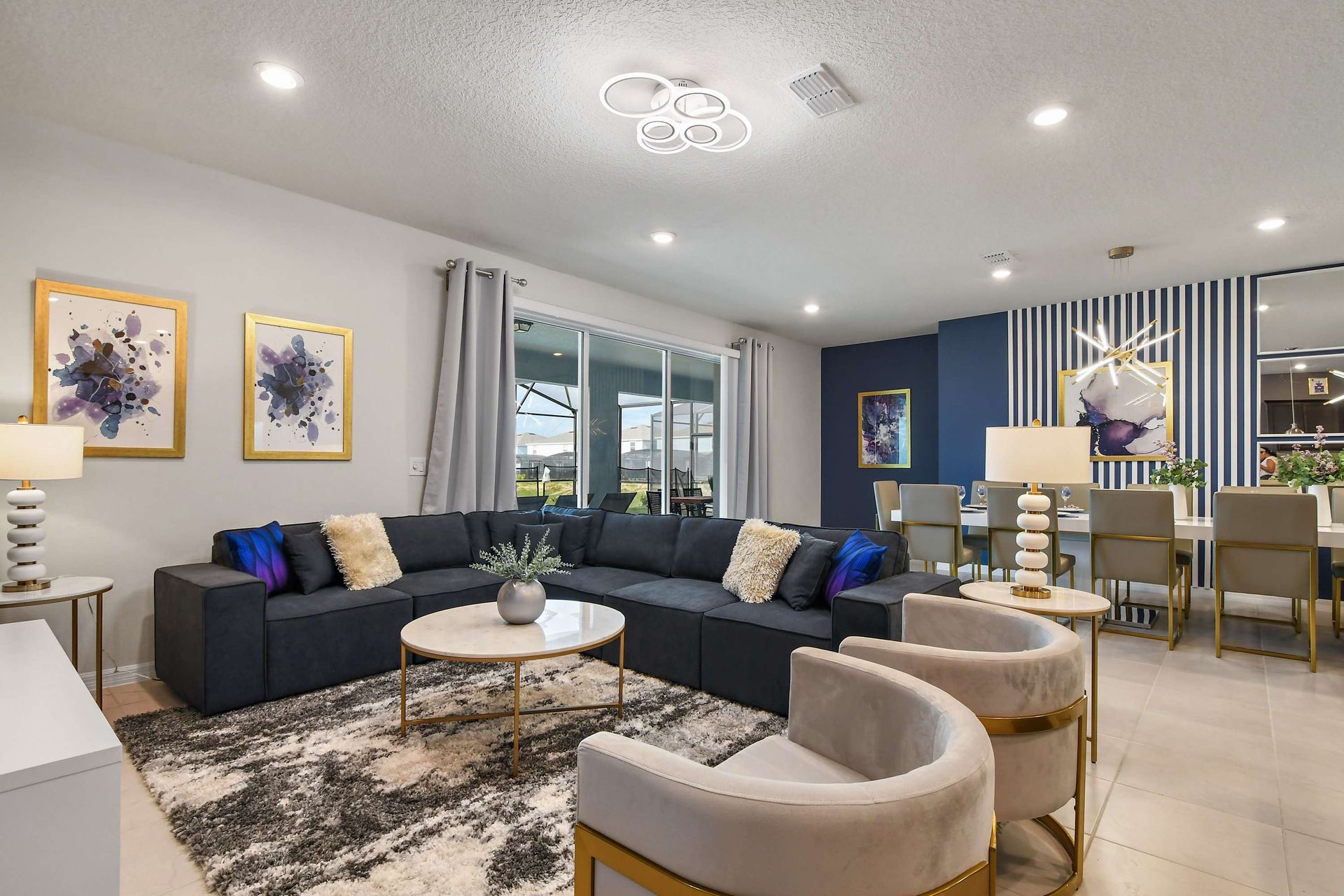 Chic open-concept living space with plush seating and elegant modern décor