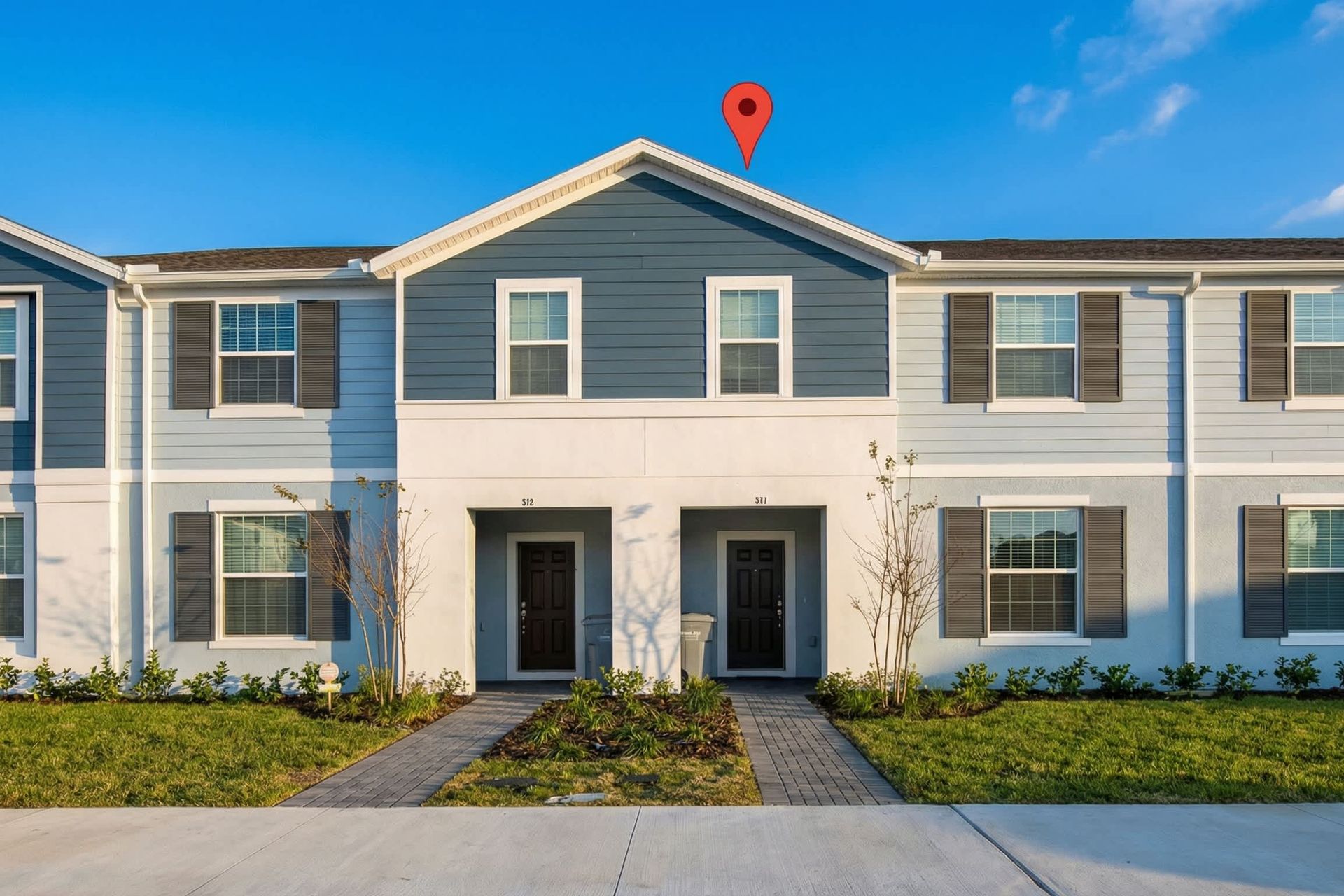 Modern townhouse with stylish exterior, private entry, and convenient parking.