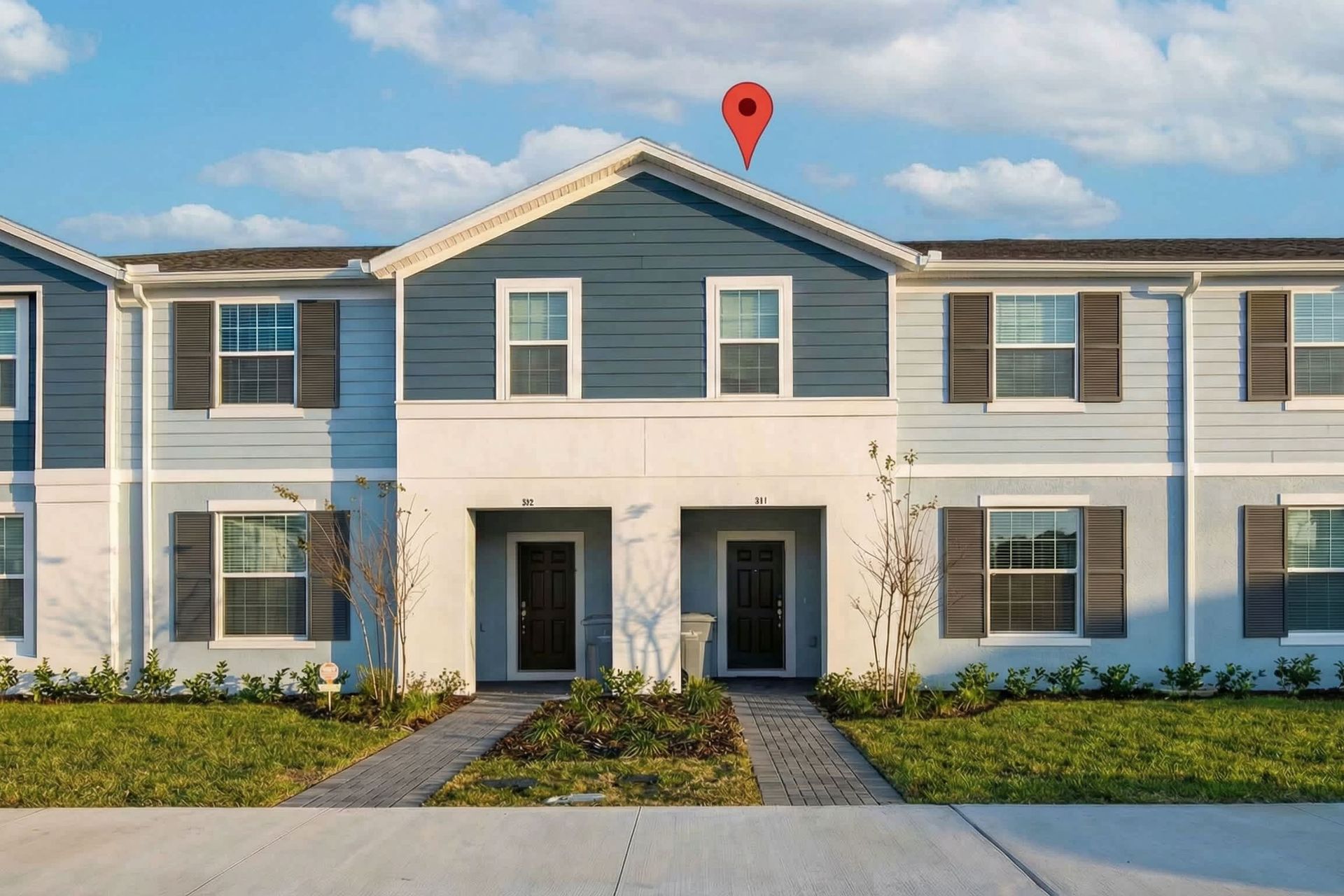 Modern townhouse with stylish exterior, private entry, and convenient parking.