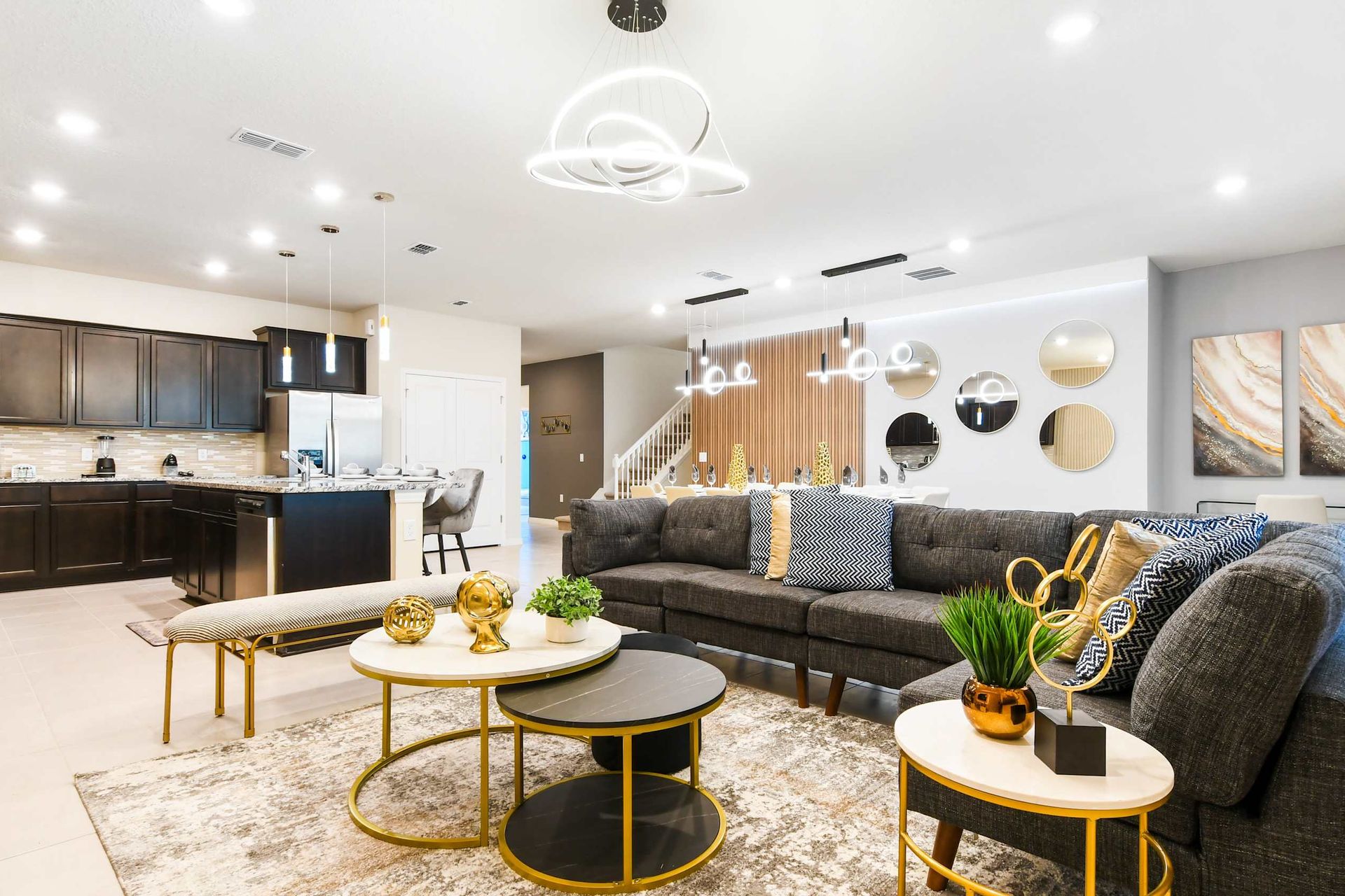 Spacious modern haven with designer kitchen, chic decor, and open social layout
