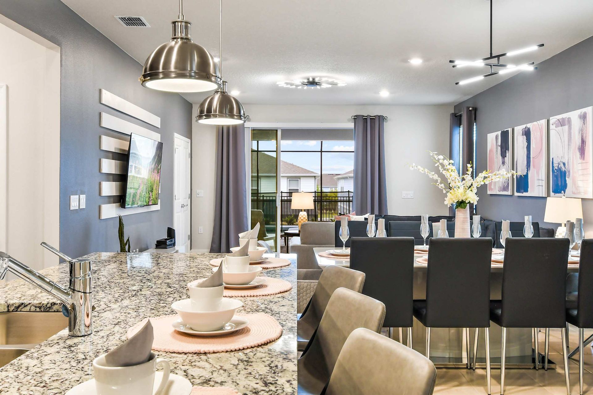 Stylish granite kitchen island and elegant dining area for memorable family meals!
