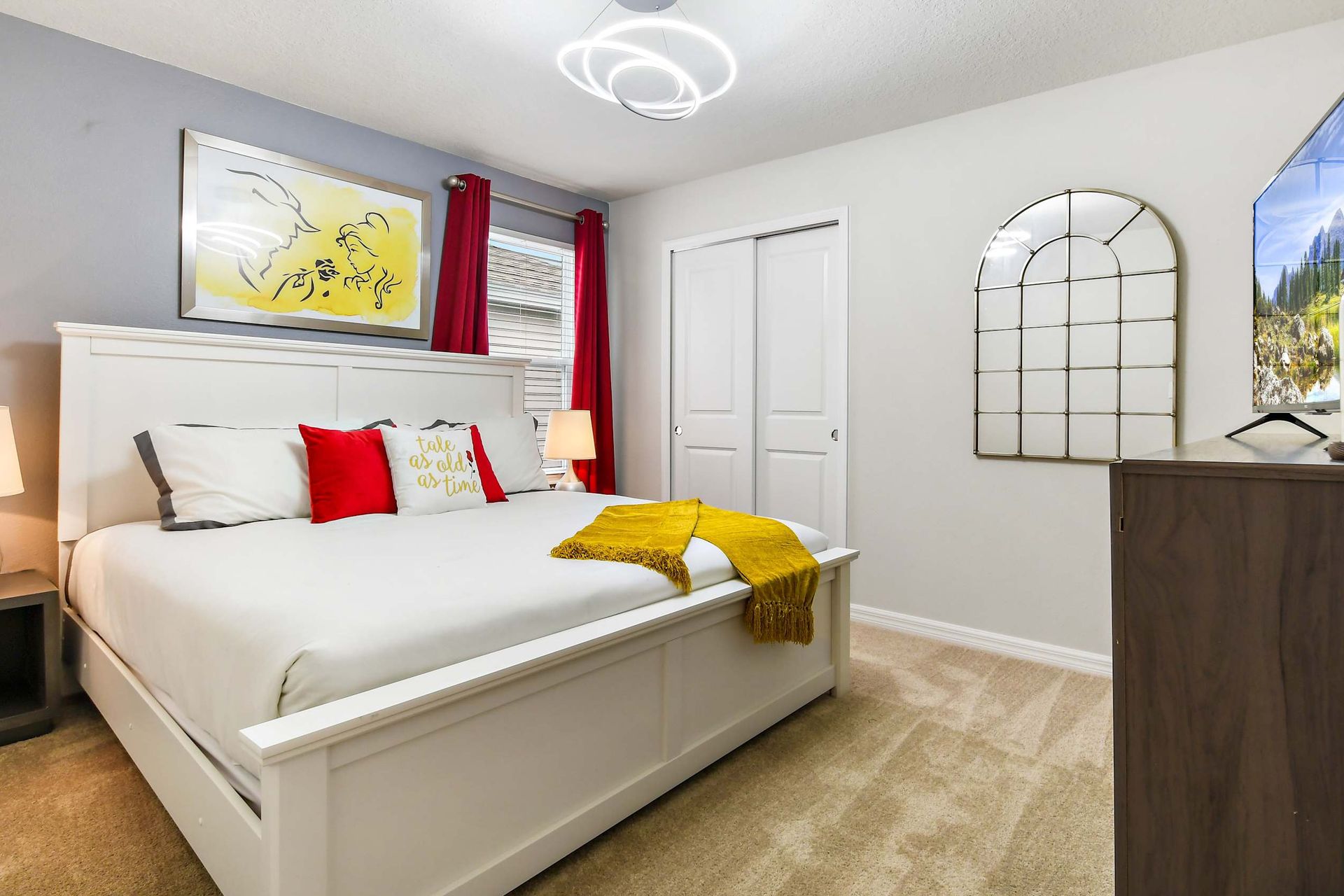Cozy Beauty and the Beast inspired bedroom with elegant decor and a smart TV!
