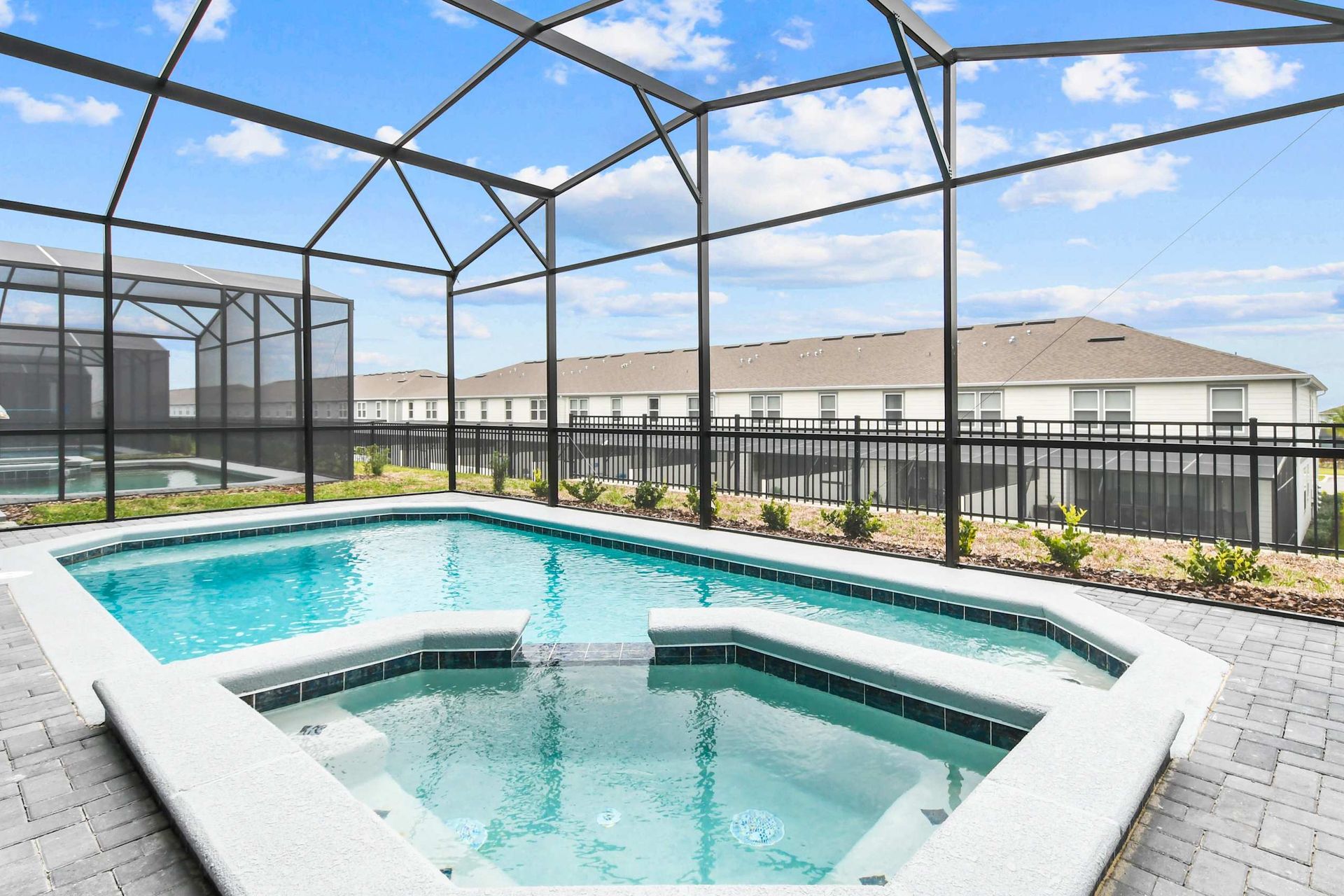 Relax in a private screened pool and spa with sunny views and peaceful vibes
