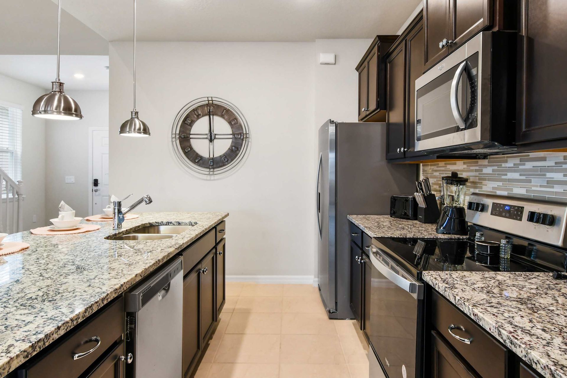 Fully equipped modern kitchen with granite countertops and stainless steel appliances!

