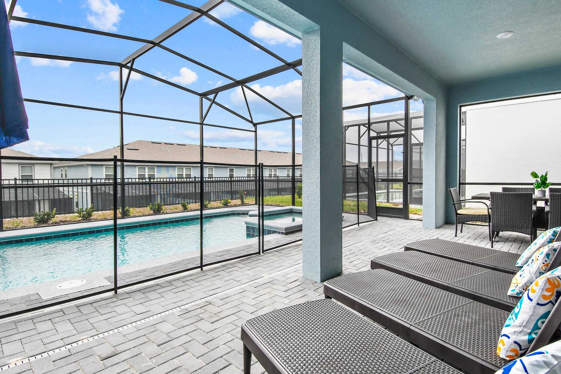 Relax by the screened private pool on comfy loungers with sunny resort-style vibes
