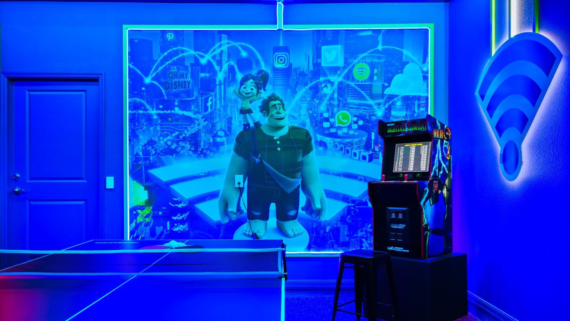 Neon arcade room with ping pong, retro games, and a vibrant digital theme.