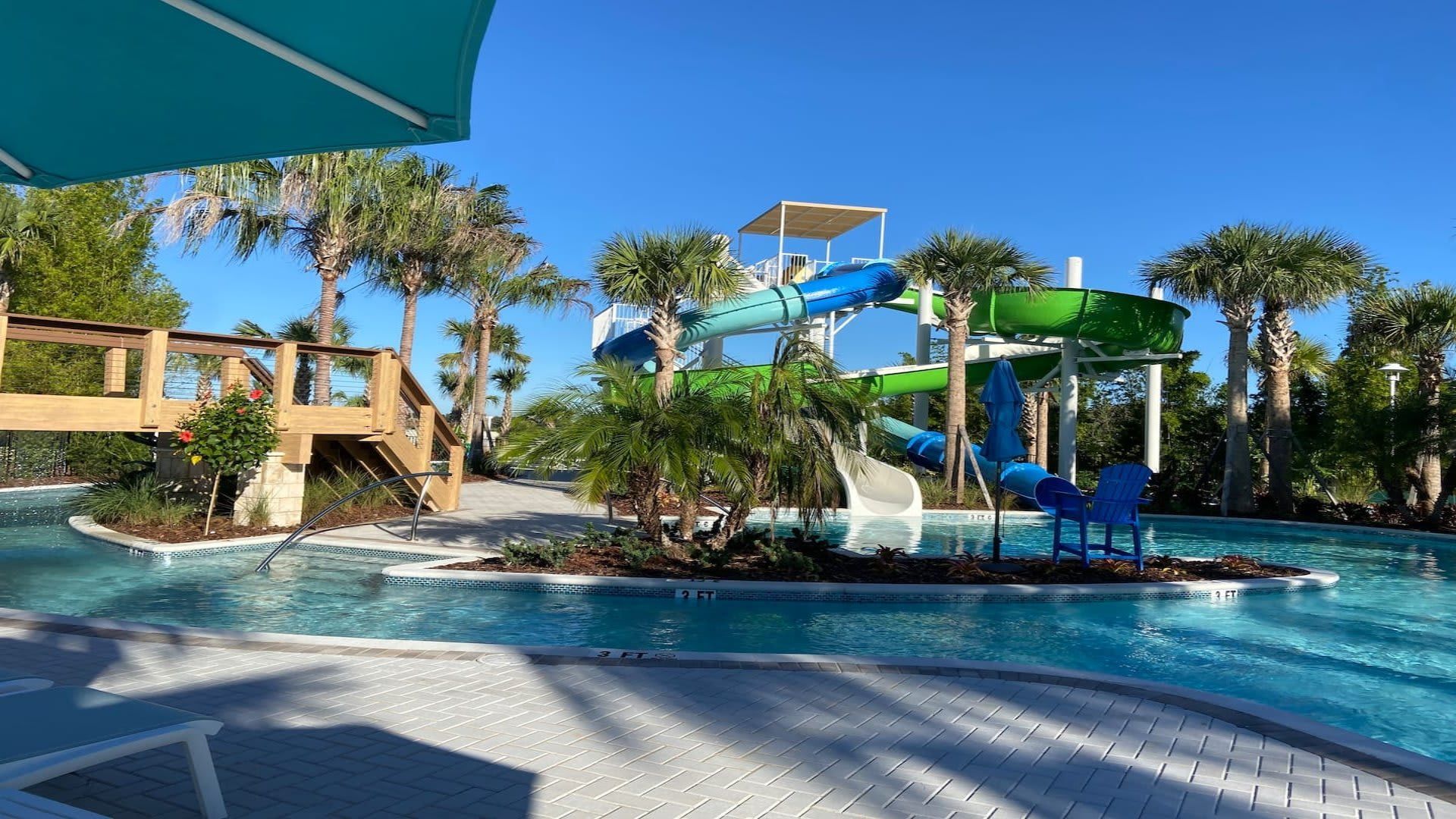 Tropical waterpark fun with towering slides, palm trees, and a lazy river.