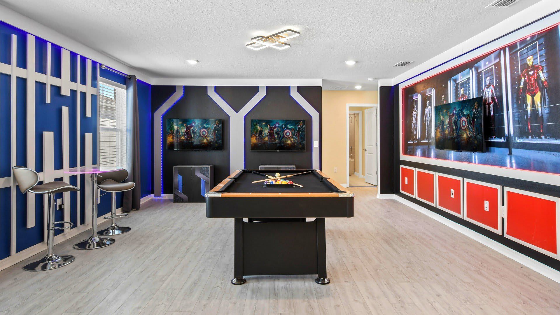 The game room is stylishly furnished with Iron Man theme
