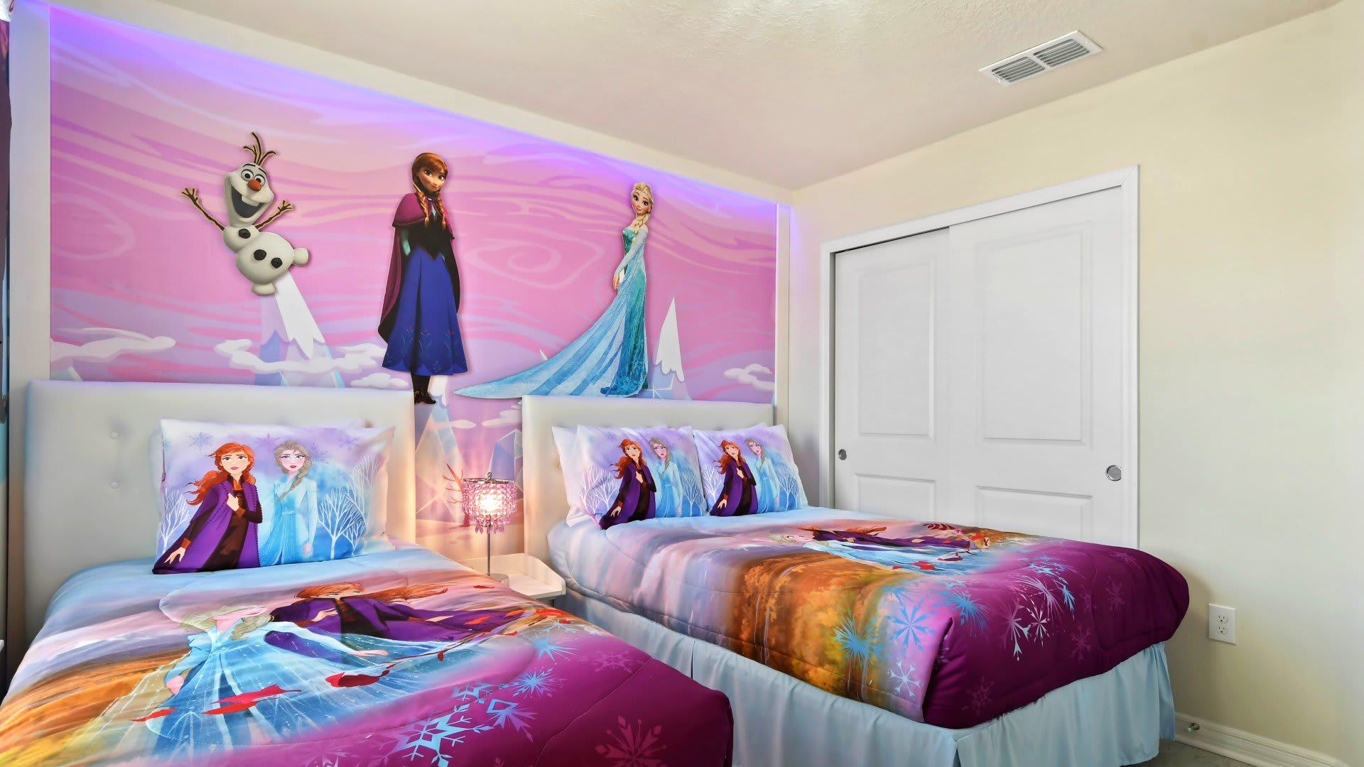 Step into a Frozen fantasy with twin beds and magical wall art your kids will love.