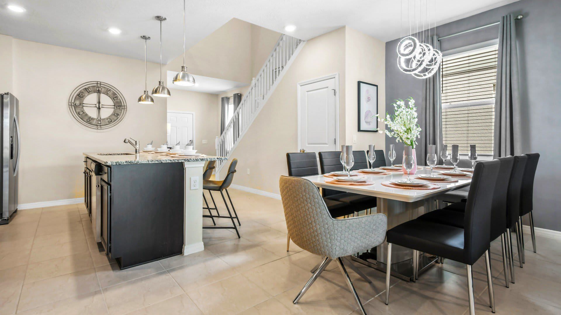 Modern kitchen and dining area with seating for 12, perfect for group gatherings.