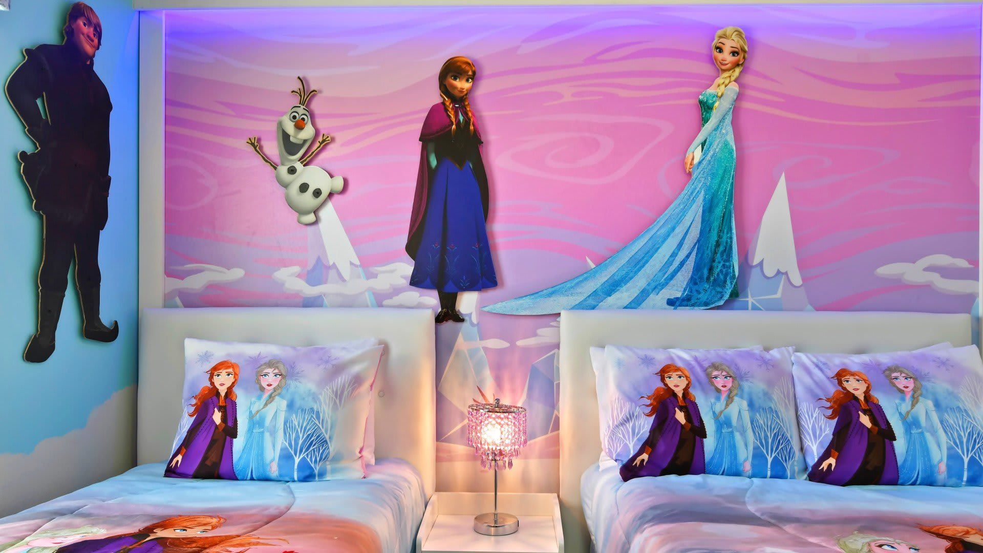 Step into a Frozen fantasy with twin beds and magical wall art your kids will love.