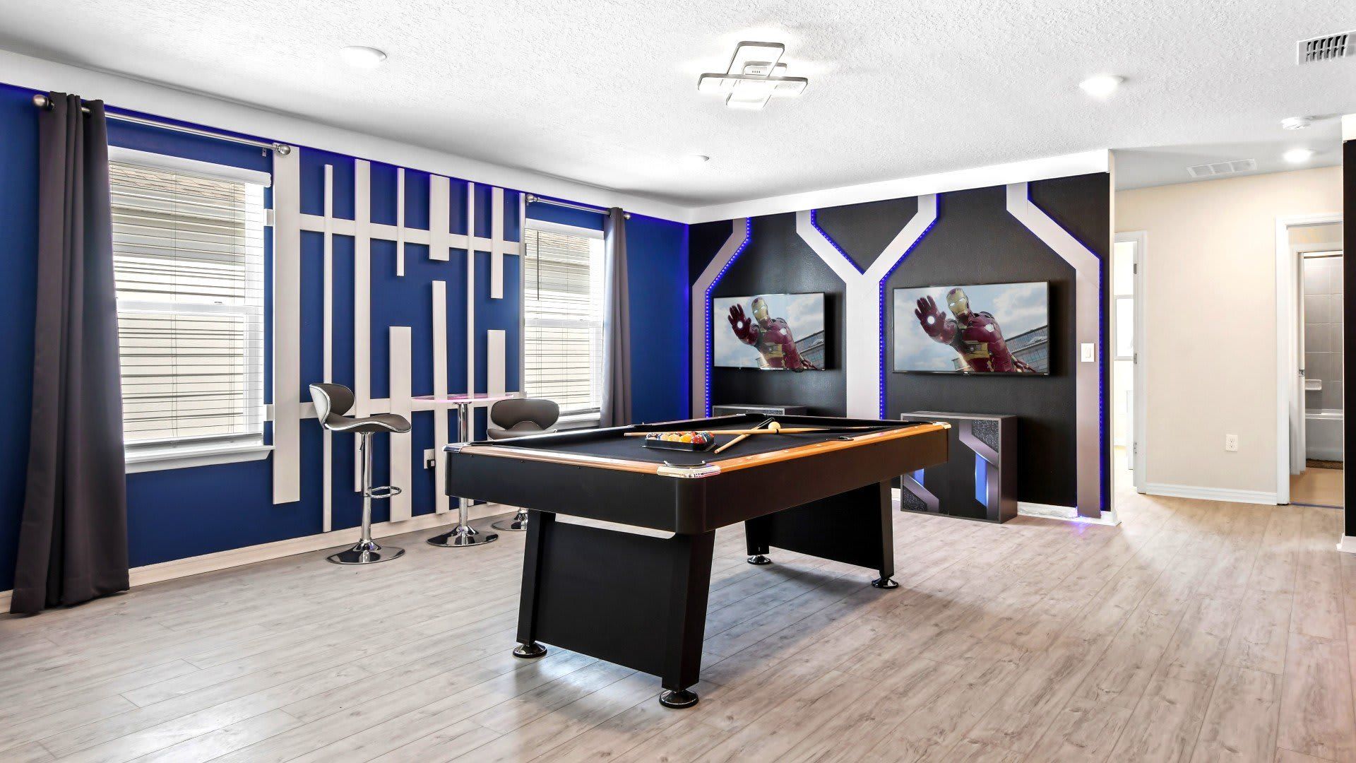 The game room is stylishly furnished with Iron Man theme.