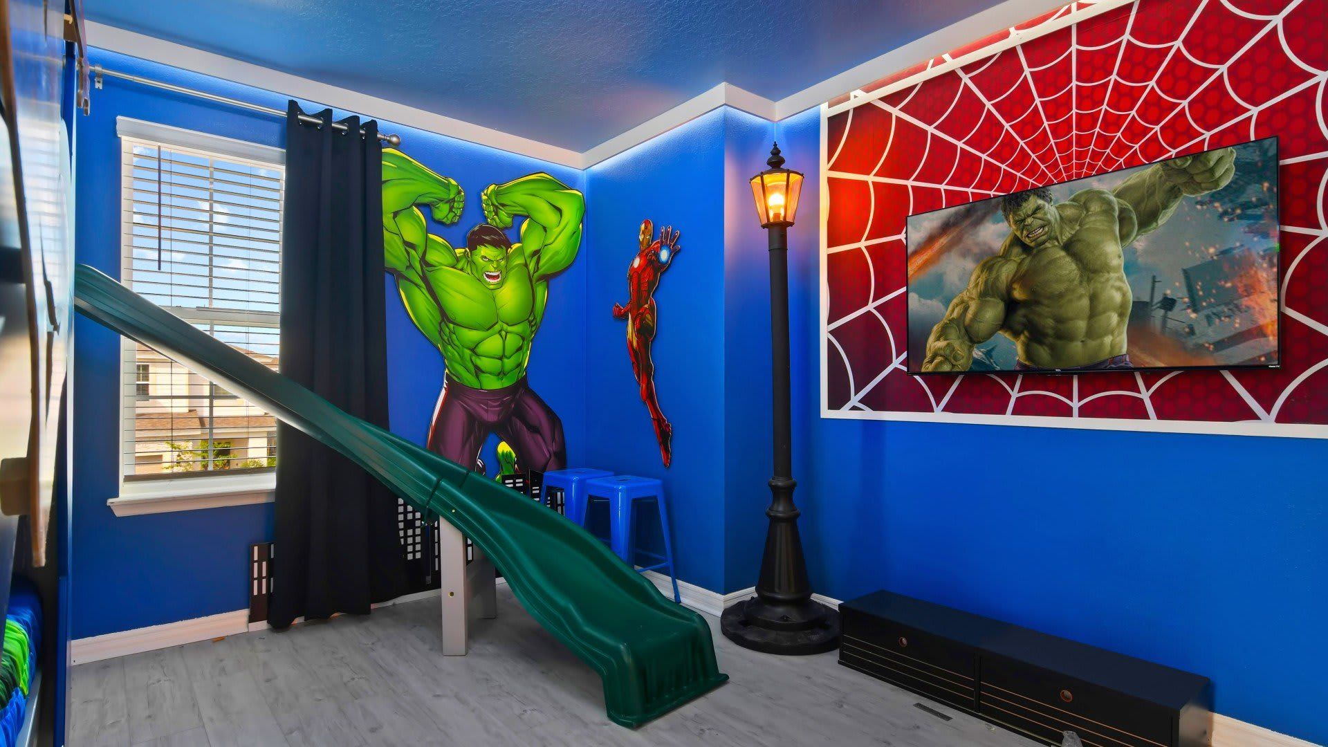 Epic superhero hideout with slide and TV—kids will never want to leave!
