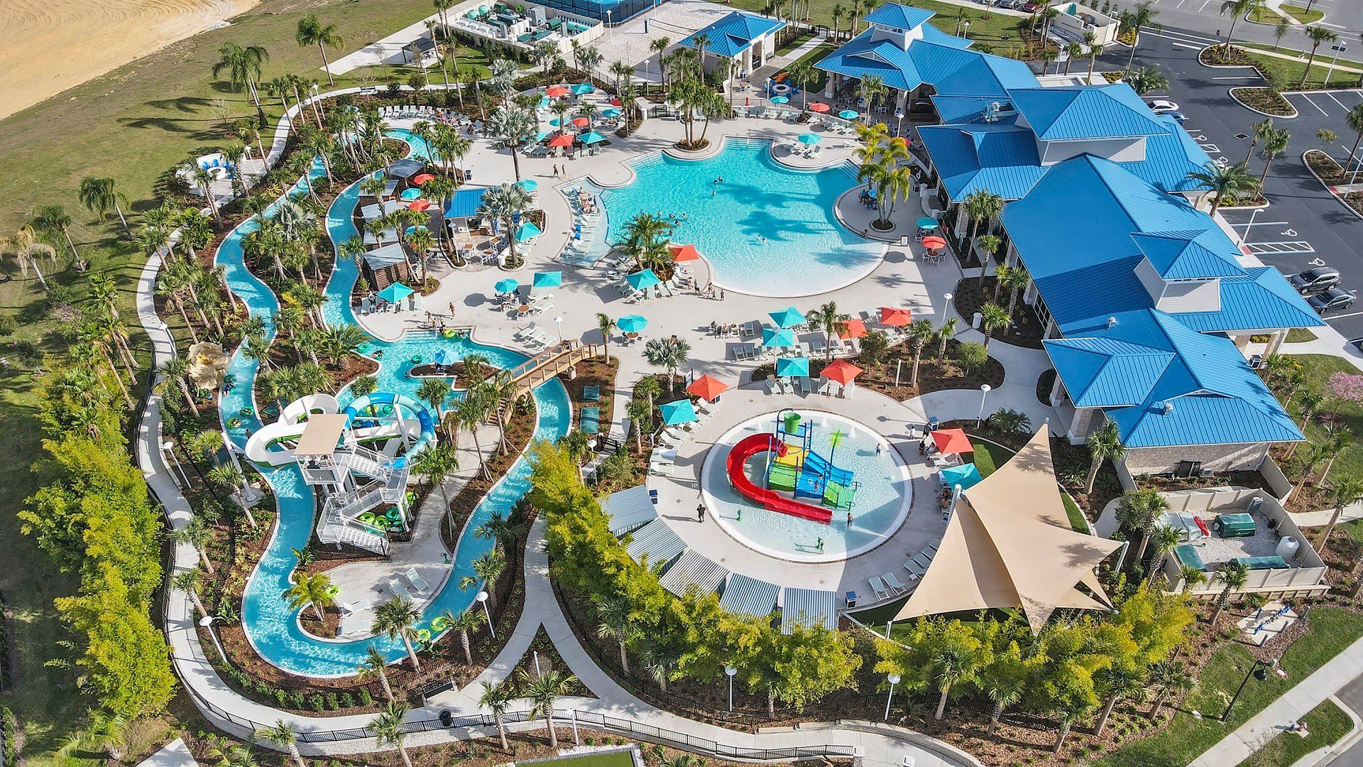Resort-style water park with lazy river, slides, splash zone, and cabanas.