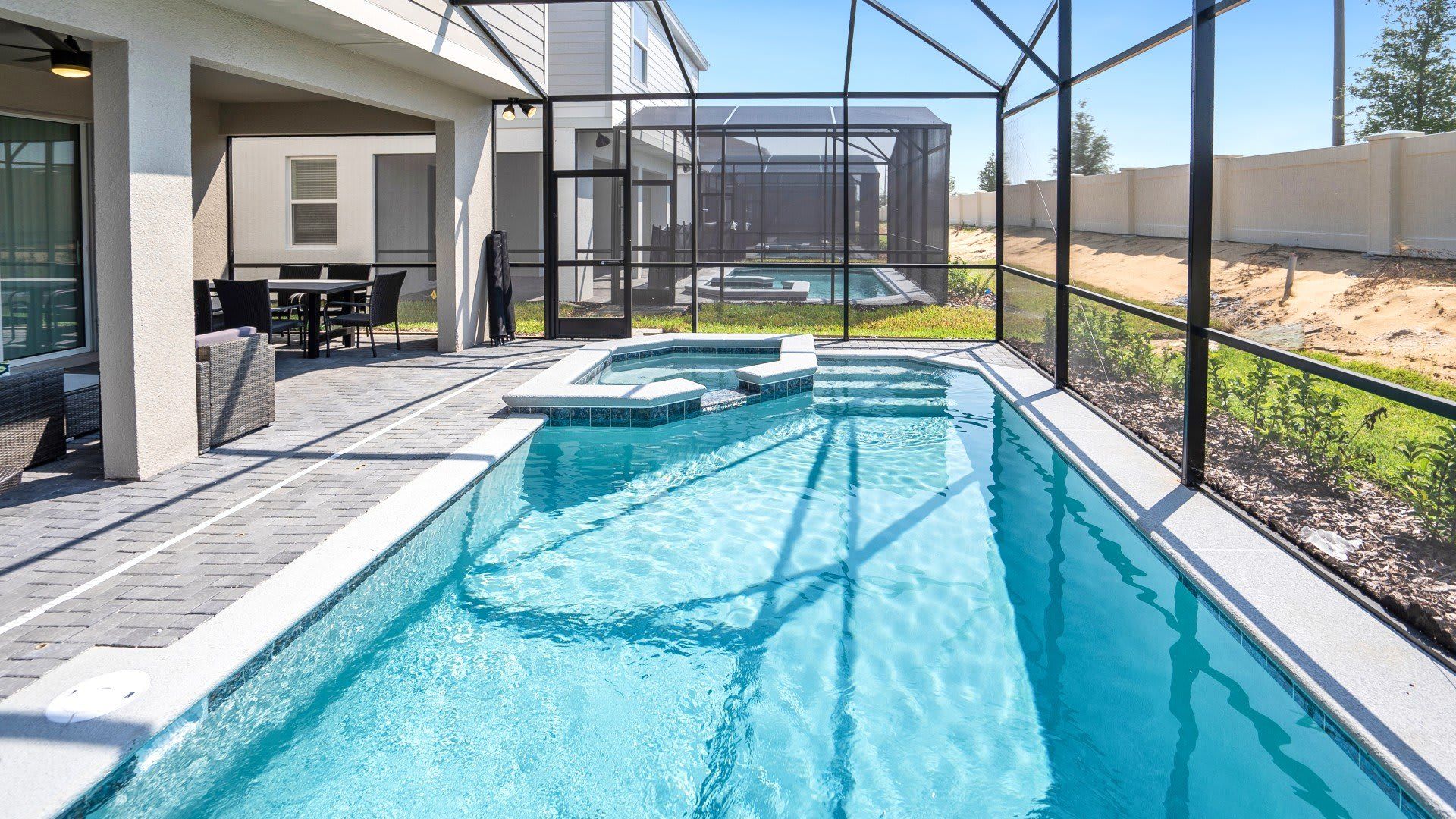 Private screened pool and spa with covered lanai—relax and unwind in style!