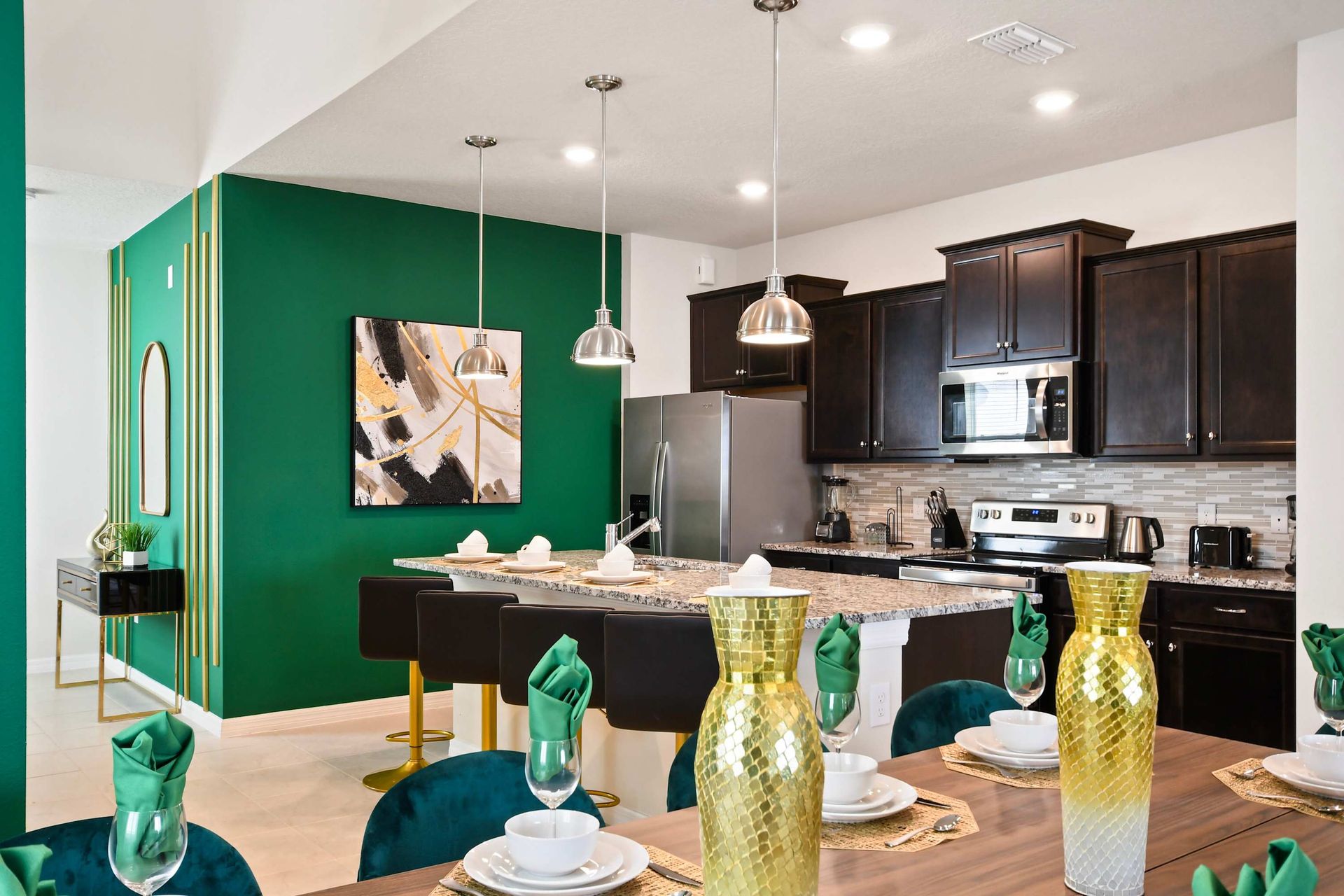 Stylish kitchen with granite countertops, stainless steel appliances, and flair.