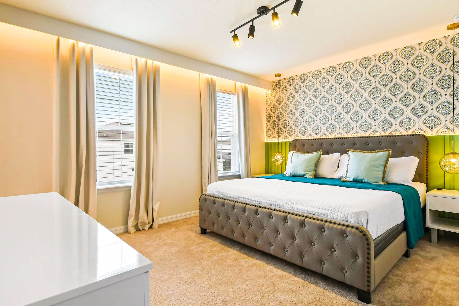 Elegant king suite with stylish decor, ambient lighting, and a cozy, modern touch.