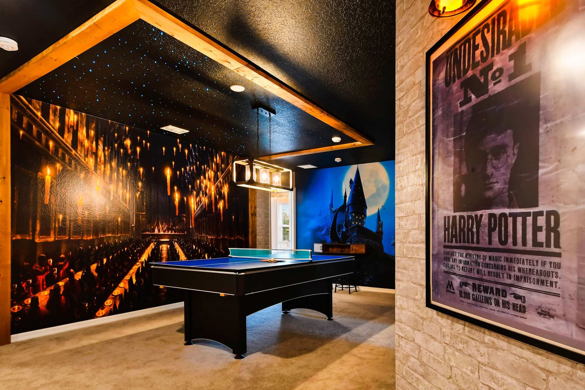 This Harry Potter-themed game room features magical decor, a ping pong table, and immersive wall art