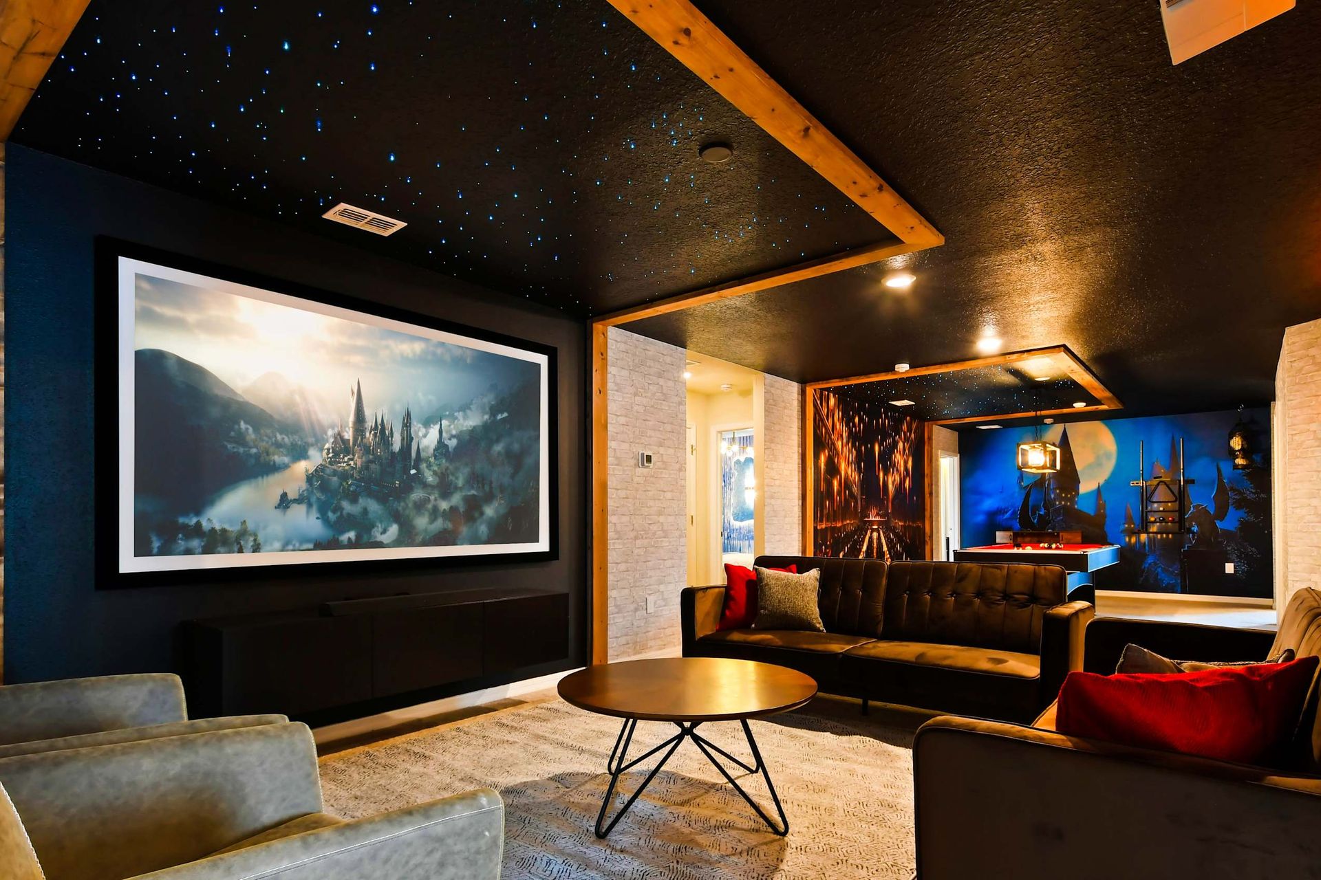 Magical Harry Potter-themed lounge with starry ceilings, cozy seating, and decor.