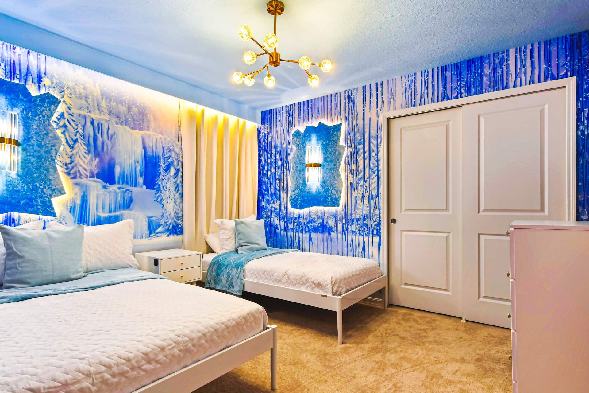 Whimsical Frozen-themed bedroom with icy decor, soft lighting, and cozy twin beds.