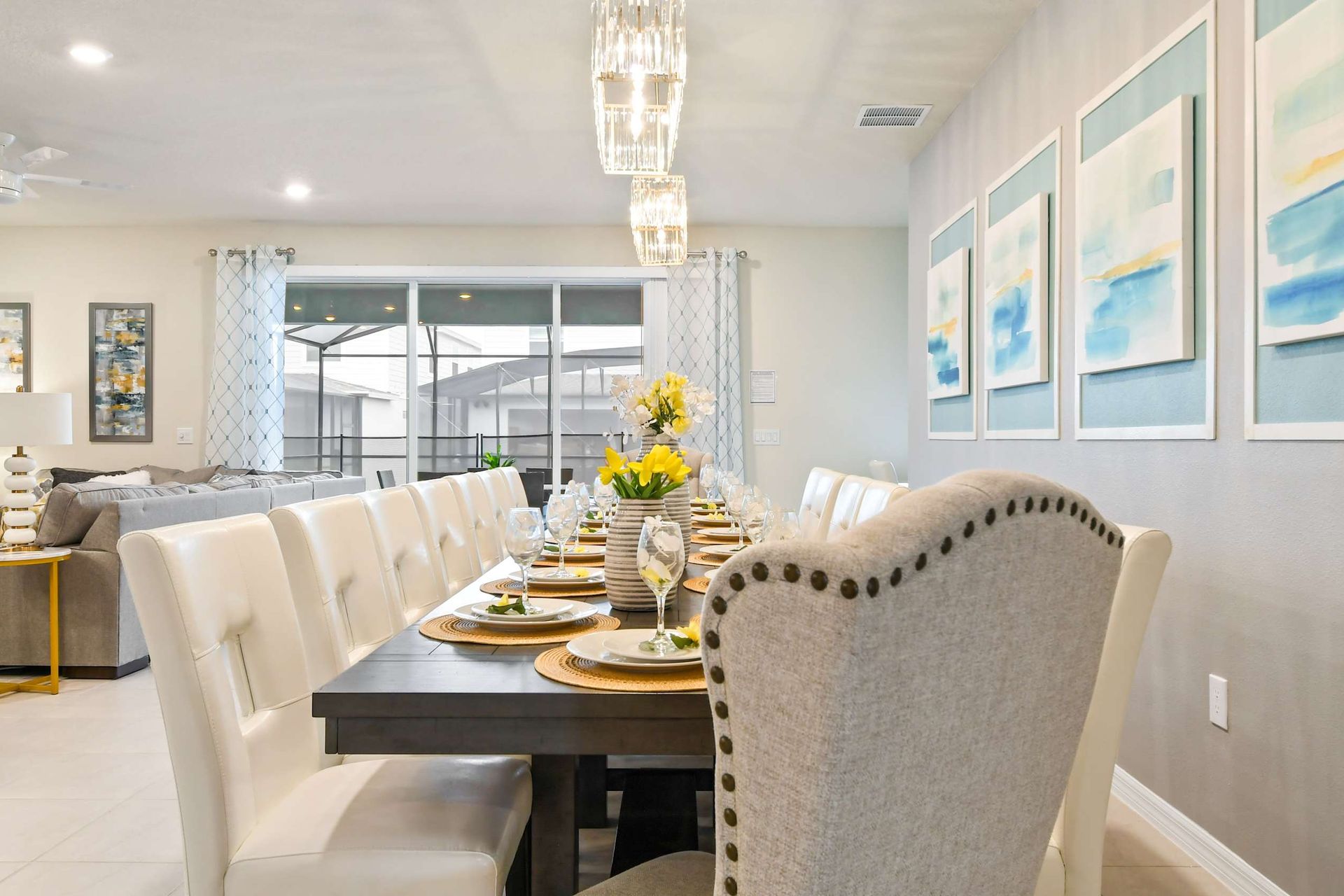 Elegant dining area with seating for a crowd, modern decor, and natural light.