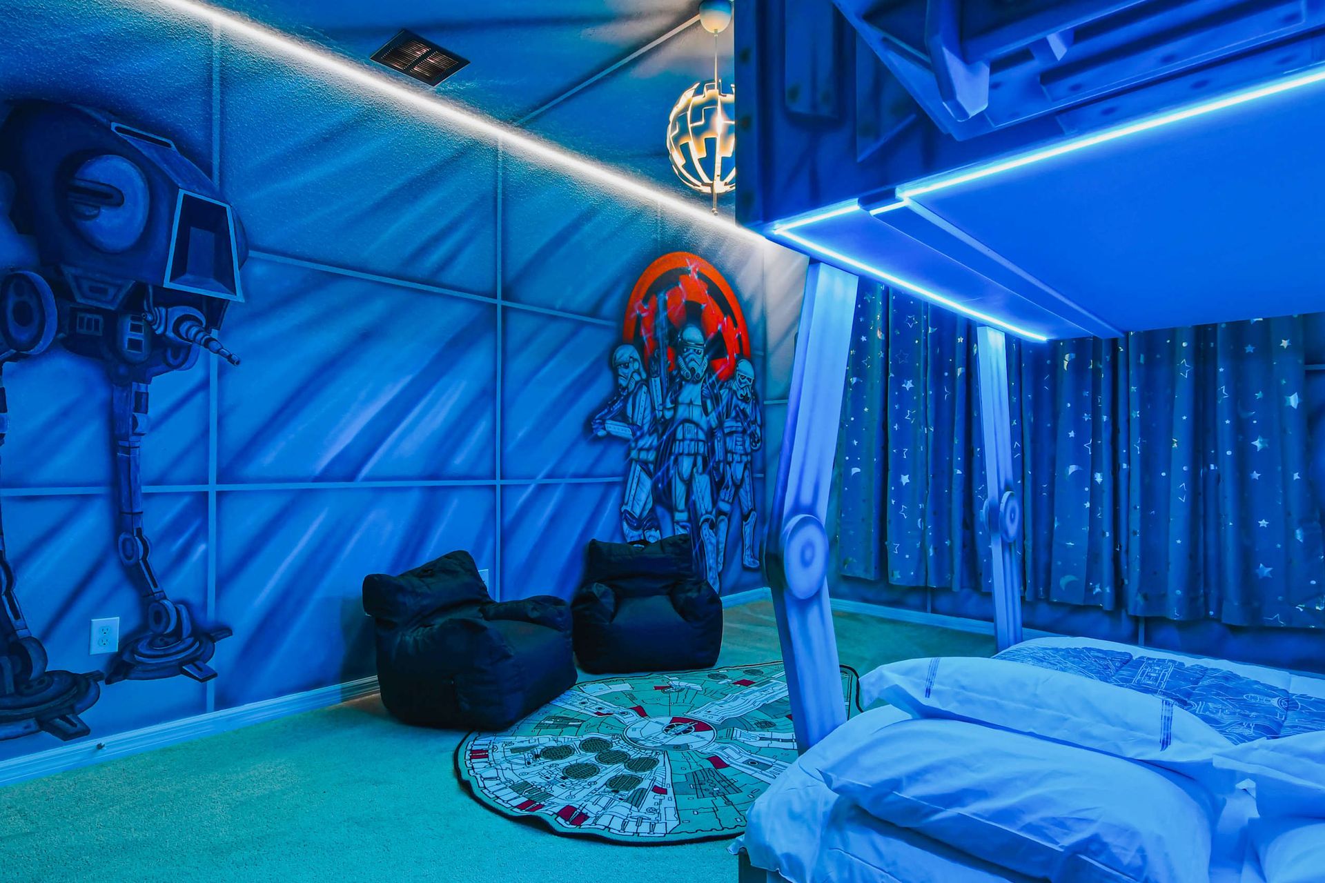 Immersive space-themed room with bunks, galaxy lighting, and epic wall art.