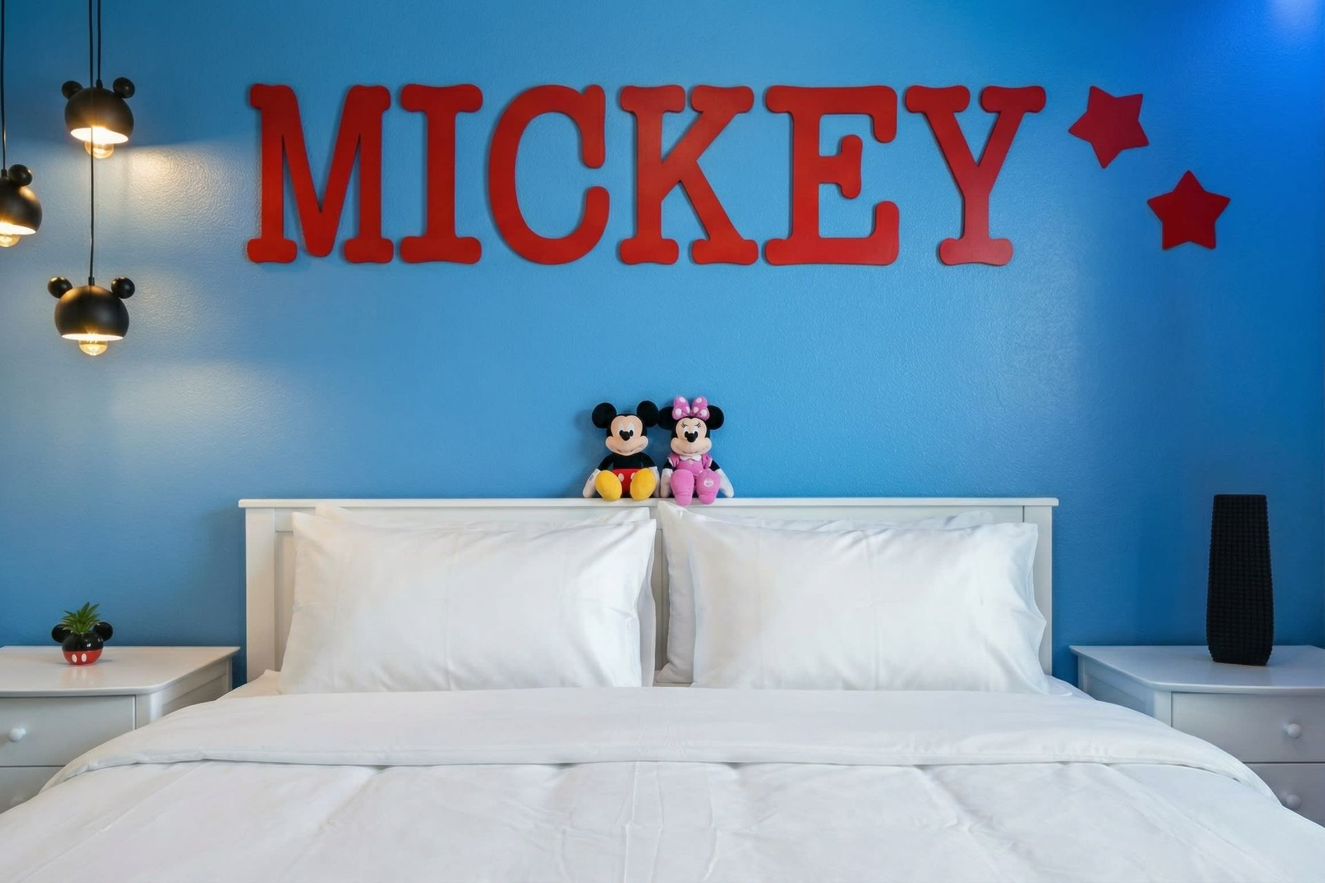 Fun Mickey-themed kids room with bold colors, cozy bedding, and playful charm.