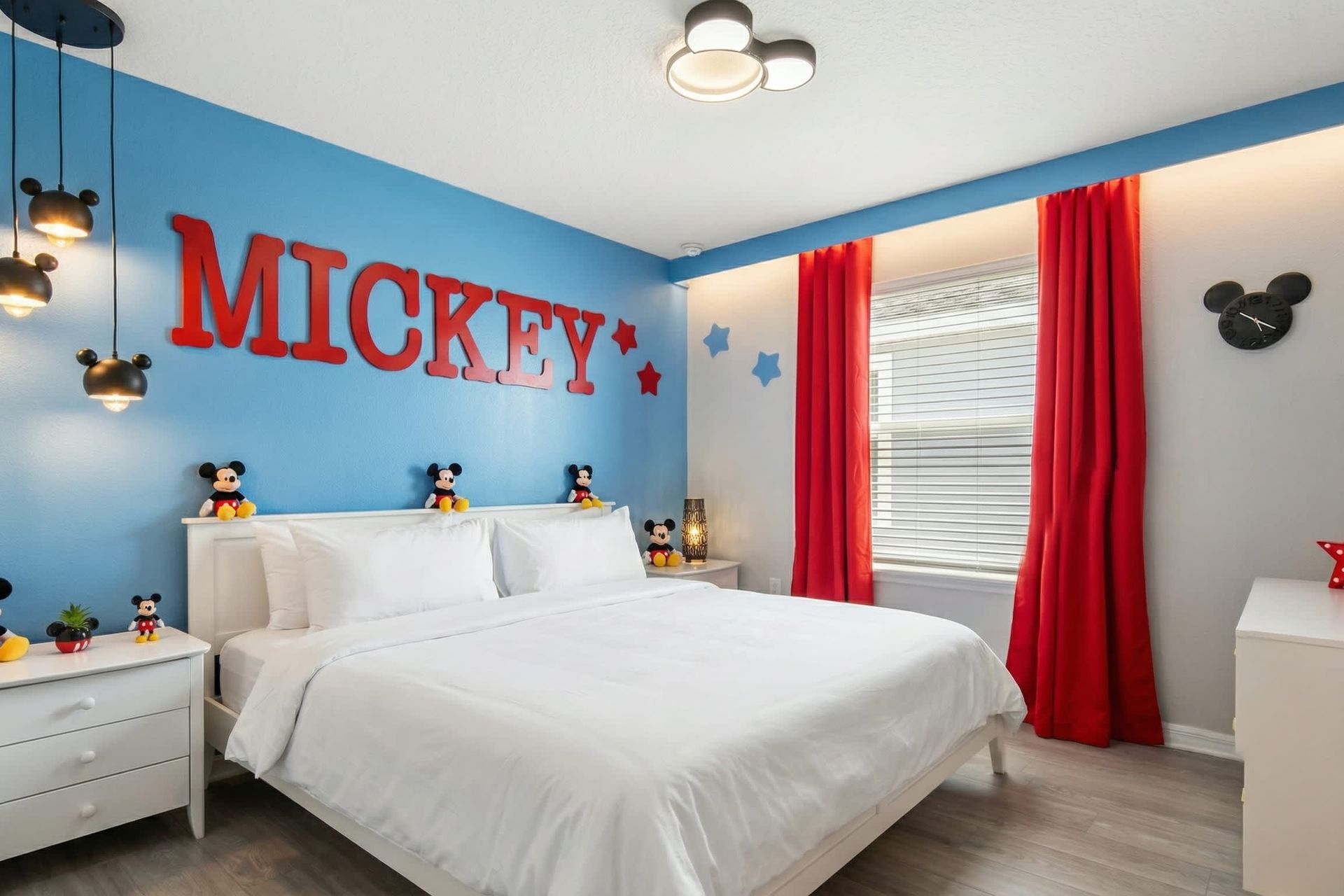 Vibrant Mickey-themed bedroom with playful decor, fun lighting, and cozy vibes.