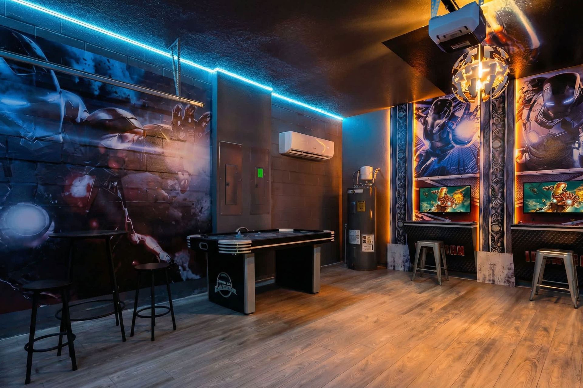 High-energy Iron Man arcade with glowing lights, gaming stations, and air hockey fun.