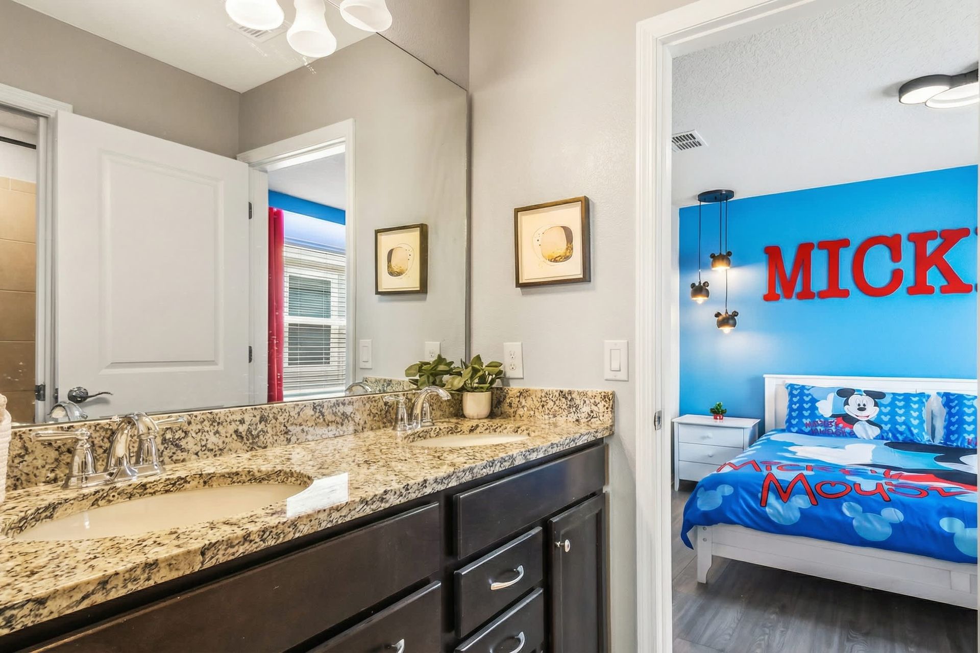 Jack-and-Jill bathroom with double sinks, perfect for connected kids’ rooms.