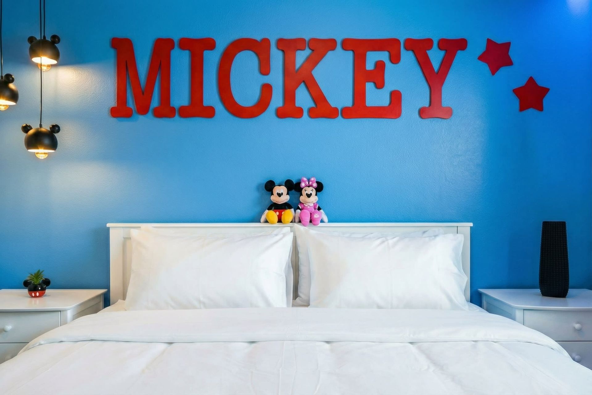 Fun Mickey-themed kids room with bold colors, cozy bedding, and playful charm.