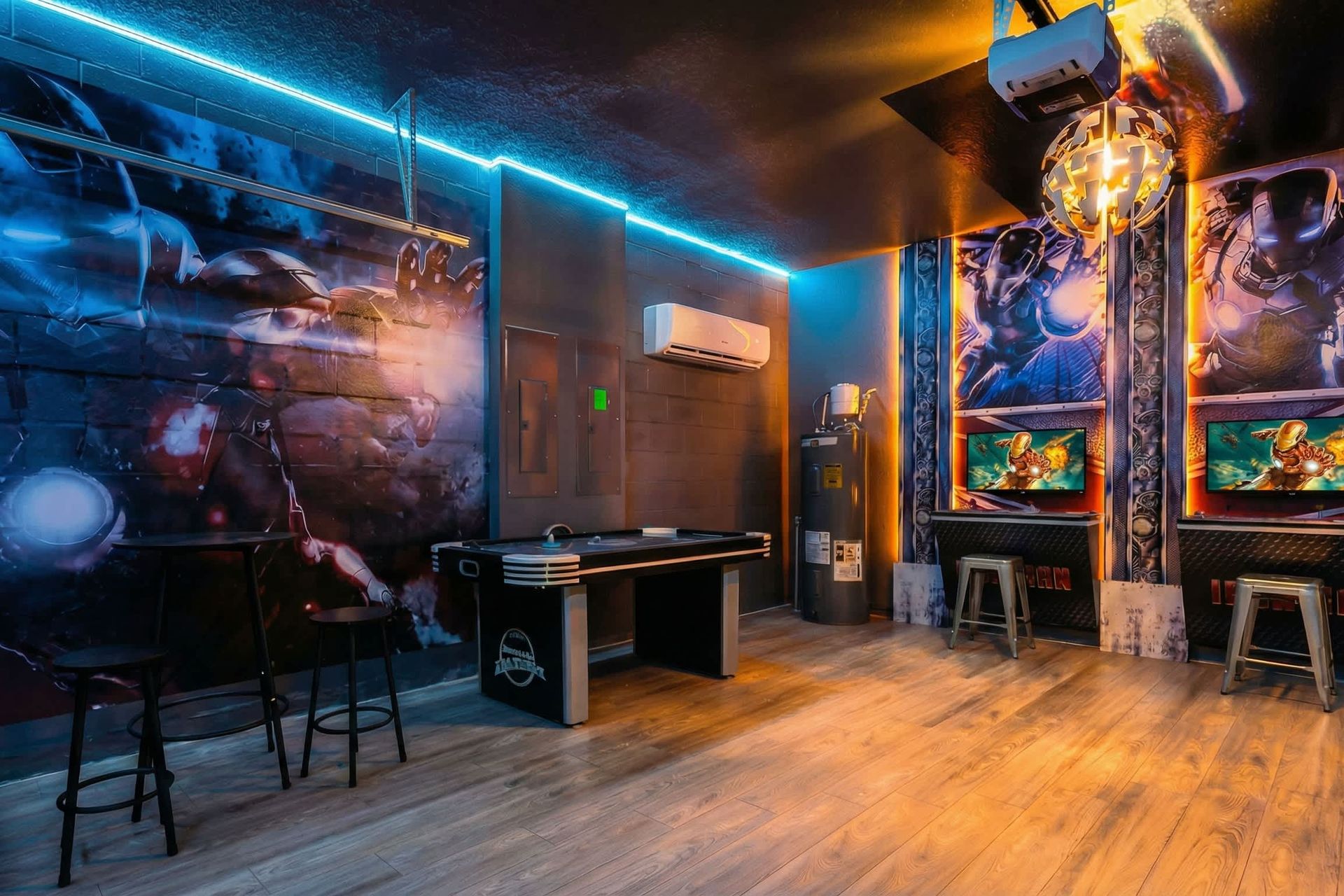 High-energy Iron Man arcade with glowing lights, gaming stations, and air hockey fun.