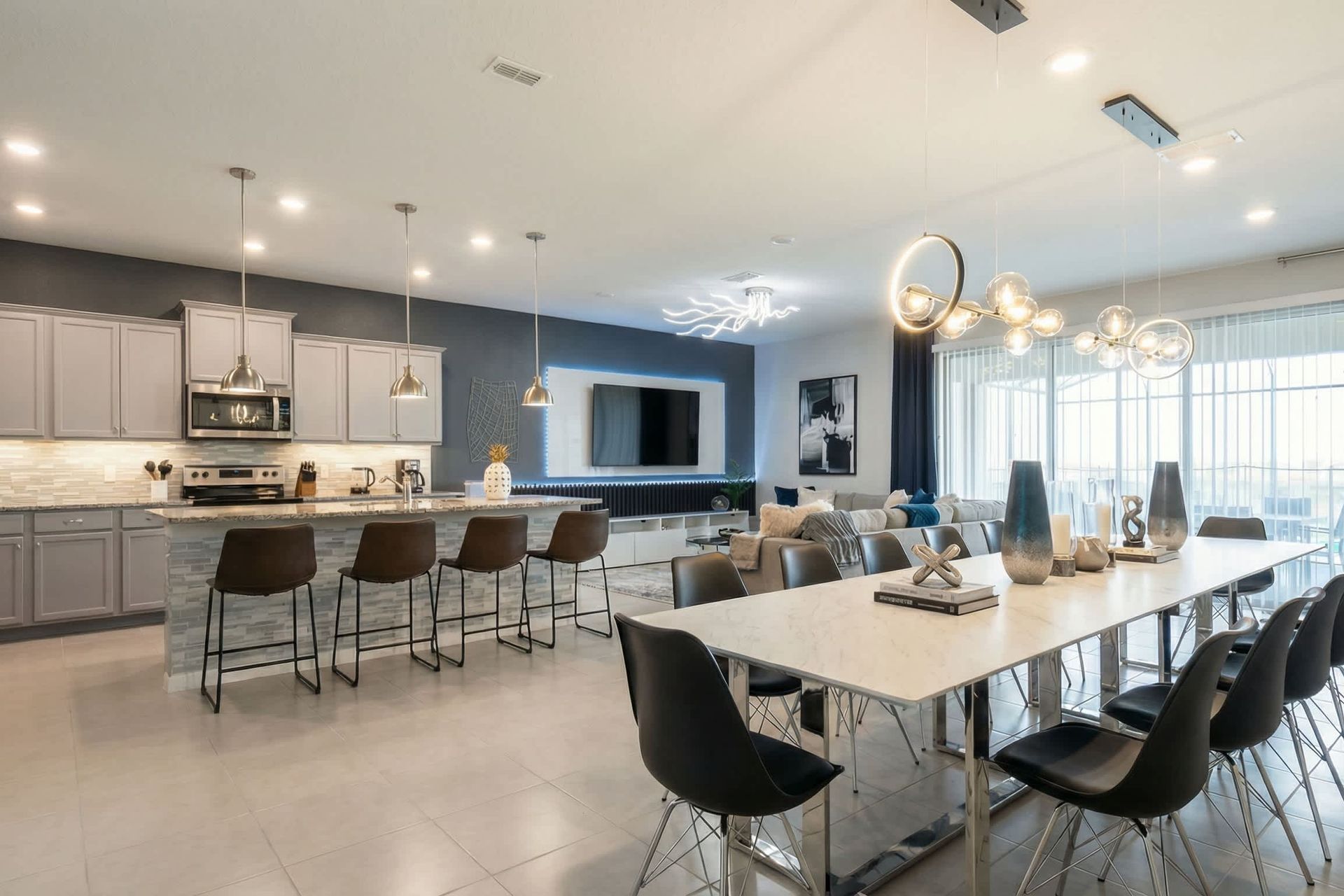 Stunning open-concept kitchen, dining, and living with upscale modern finishes.
