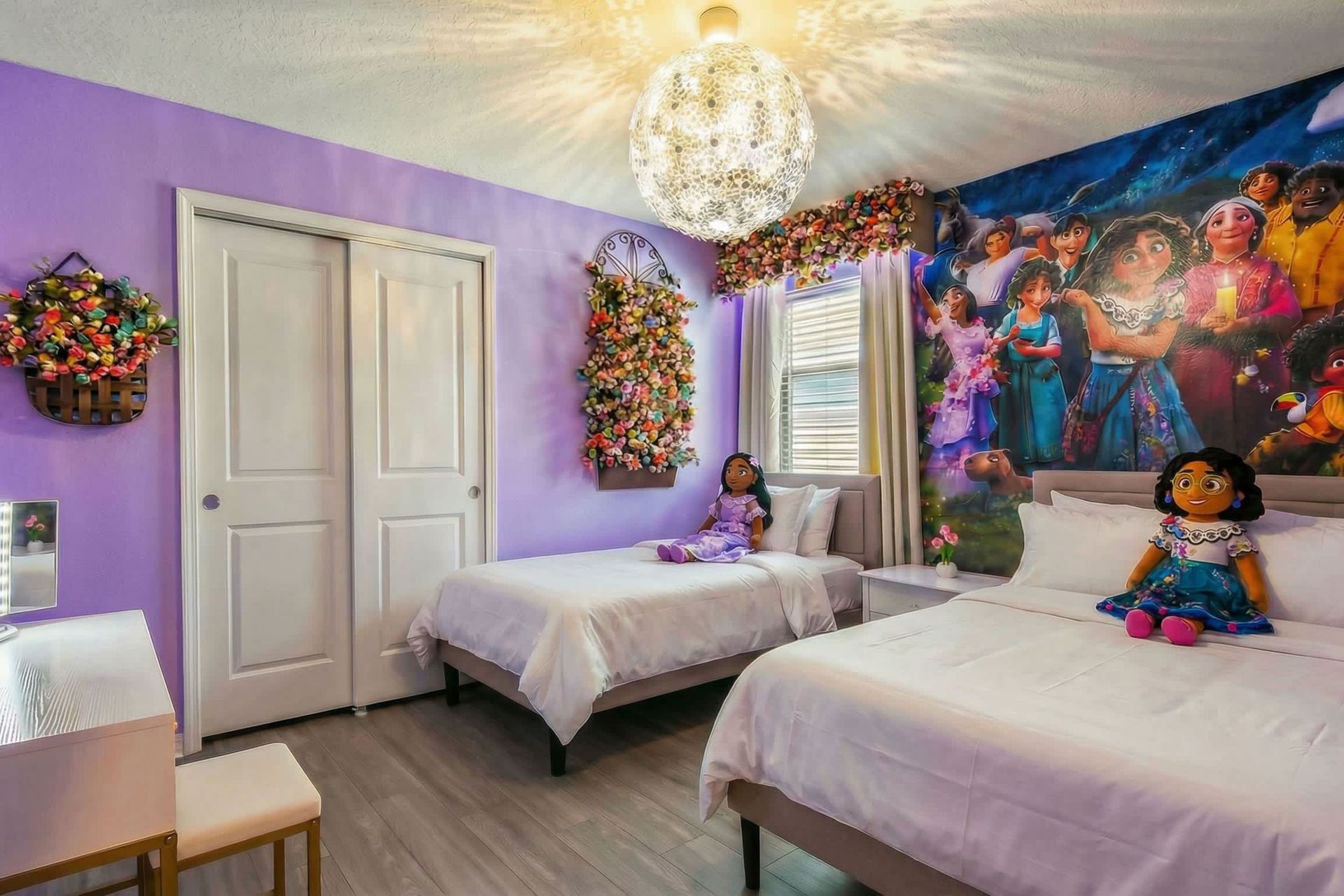 Whimsical lavender room with floral accents and vibrant character-themed wall art.