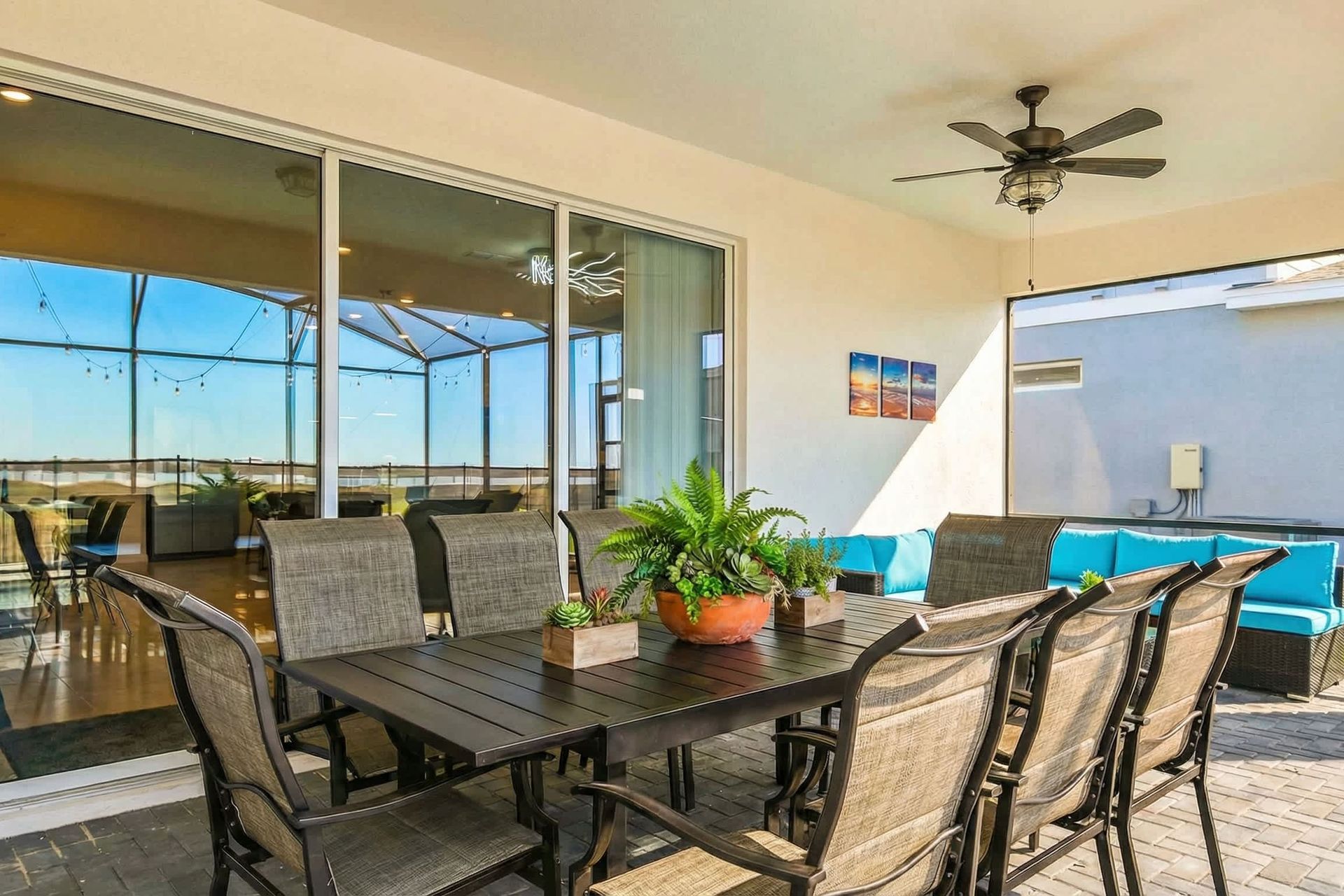 Stylish covered patio with dining area and lounge, perfect for relaxing evenings.