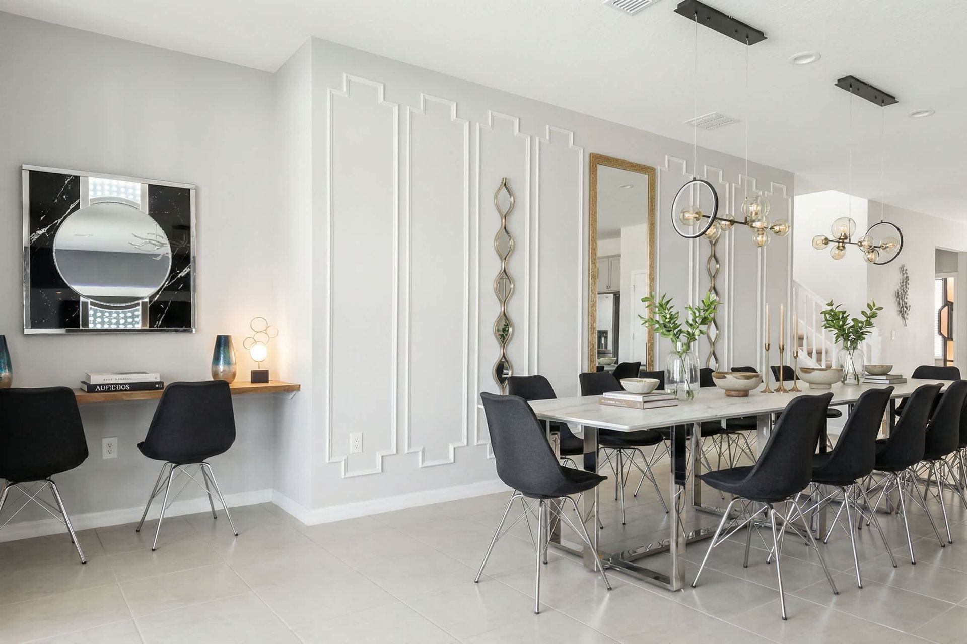 Elegant dining area with seating for 12, modern lighting, and a chic workspace.