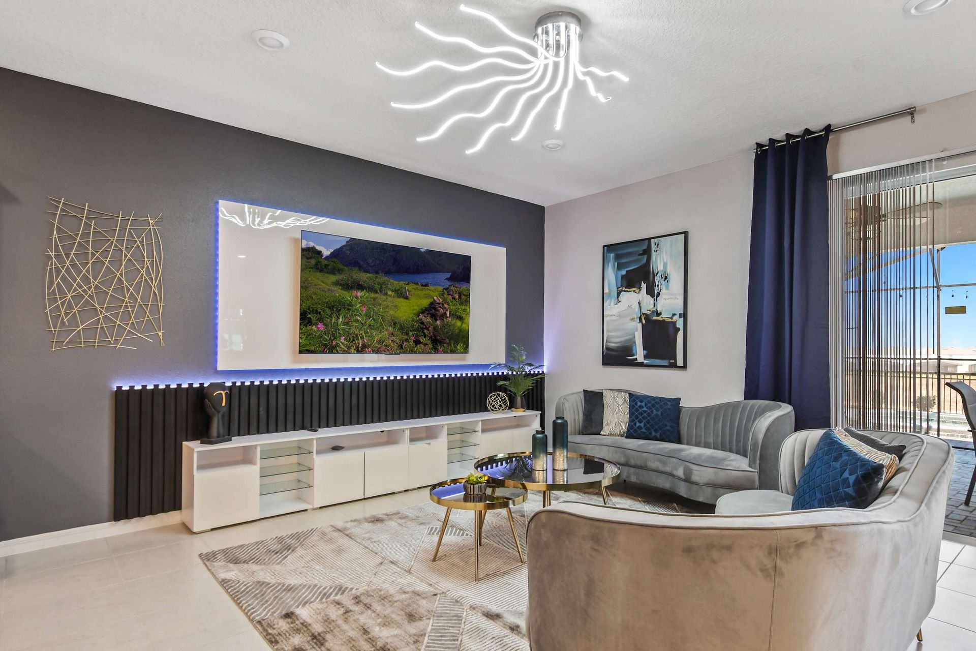 Chic modern living room with sleek decor, LED accents, and poolside views.
