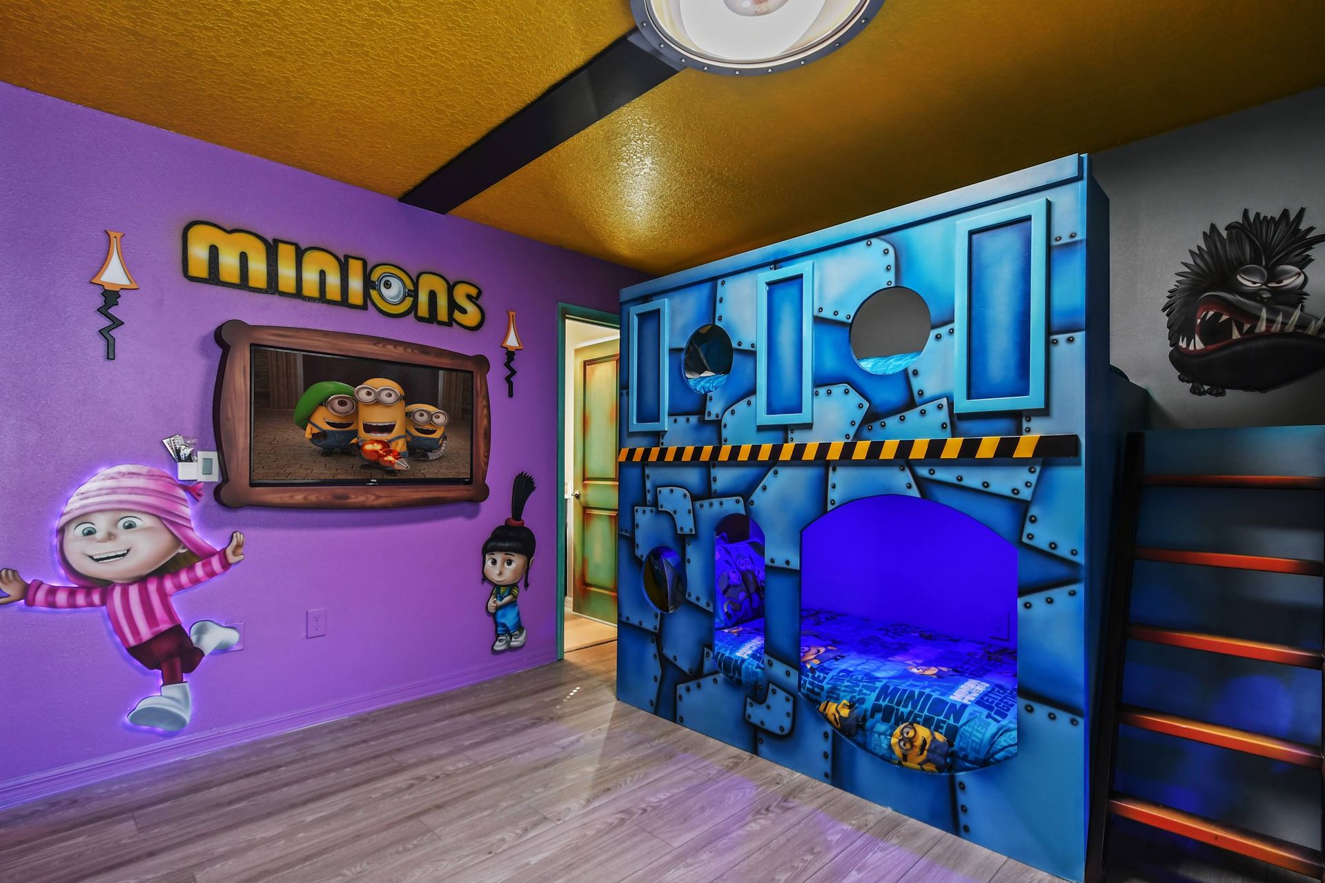 Minions-themed bunk room bursting with color, character fun, and cool glowing beds.