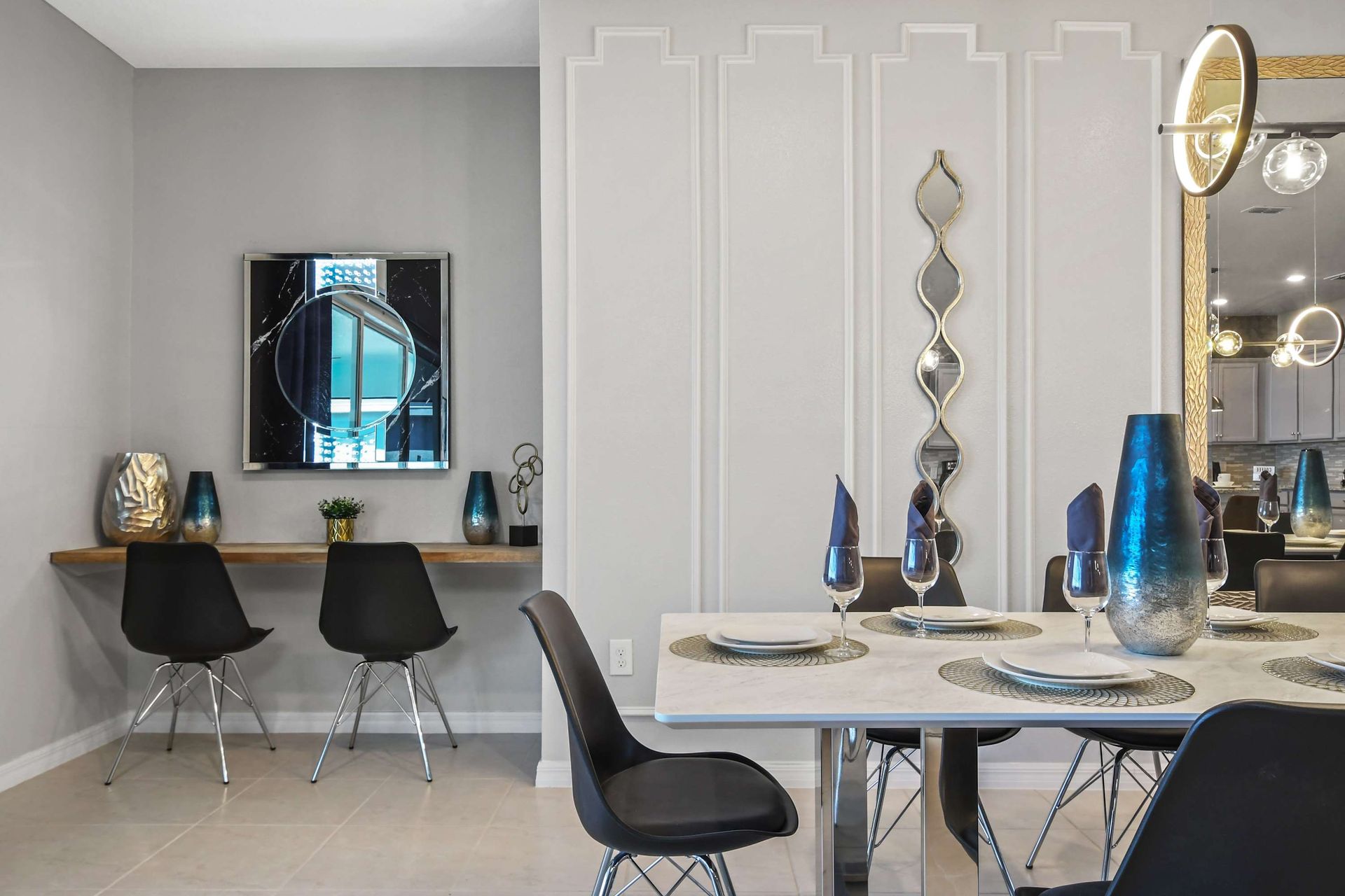 Chic dining space with a stylish two-person workspace and modern artistic flair.