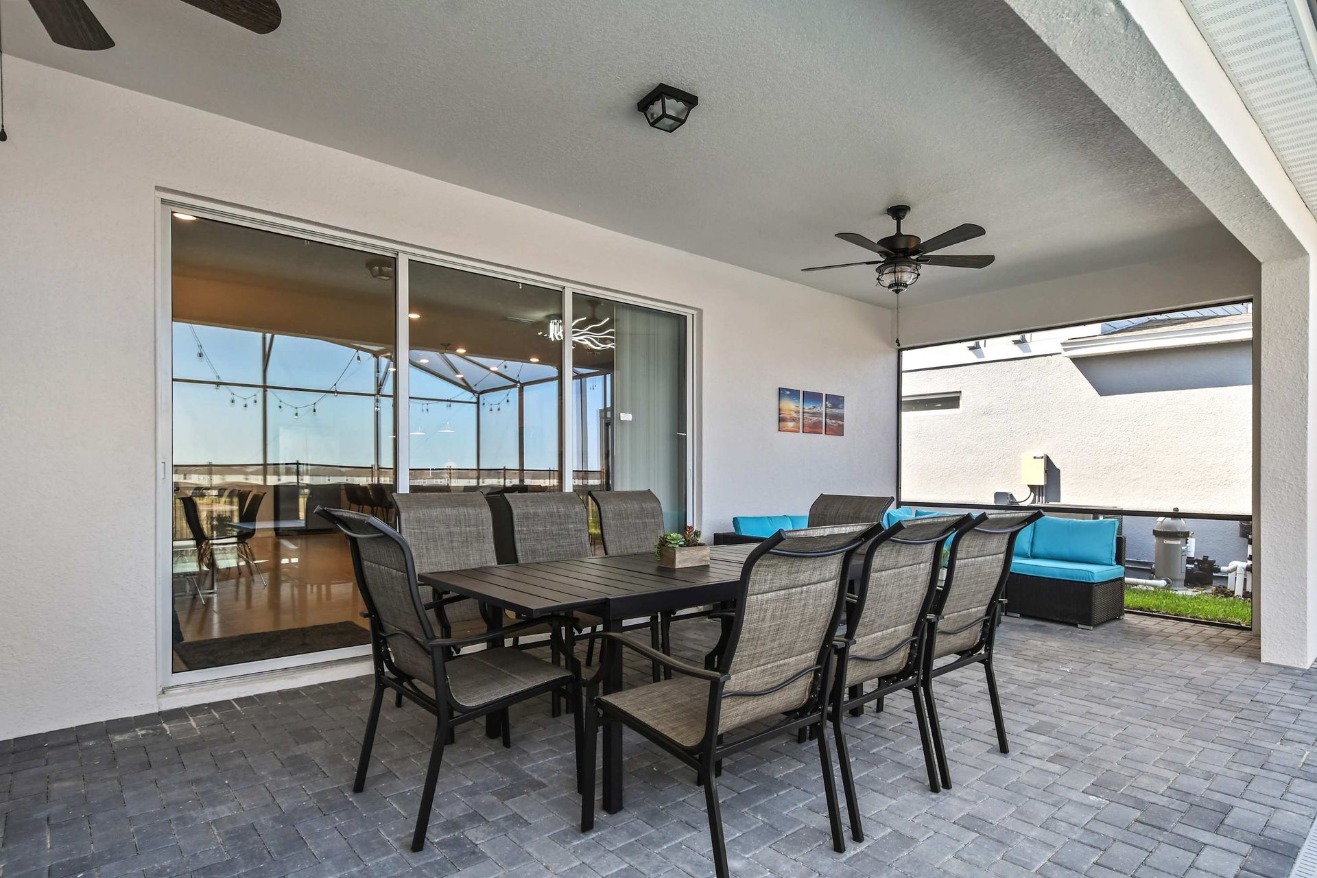 Stylish covered patio with dining area and lounge, perfect for relaxing evenings.