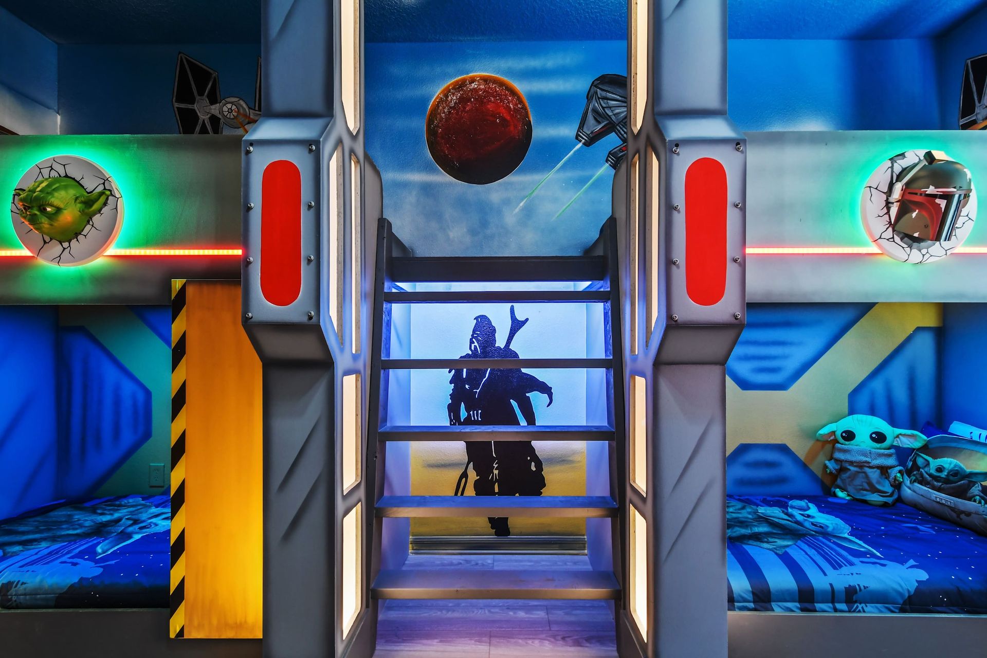 Galactic-themed bunk room with epic space murals, glowing lights, and starry bedding.