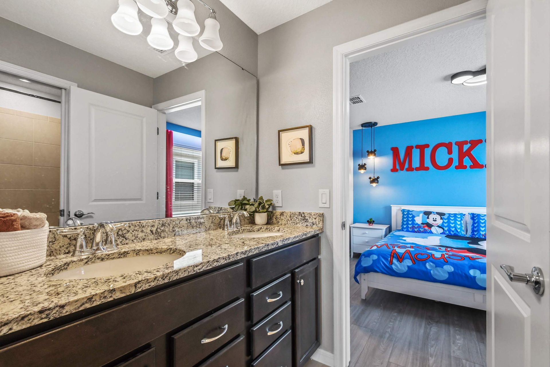 Jack-and-Jill bathroom with double sinks, perfect for connected kids’ rooms.