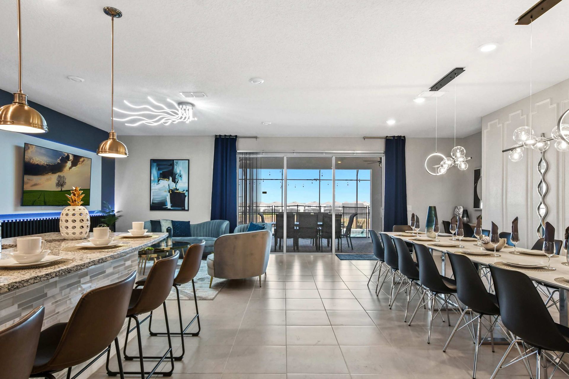 Bright open space with breakfast bar, luxe dining, stylish lounge, and pool views.