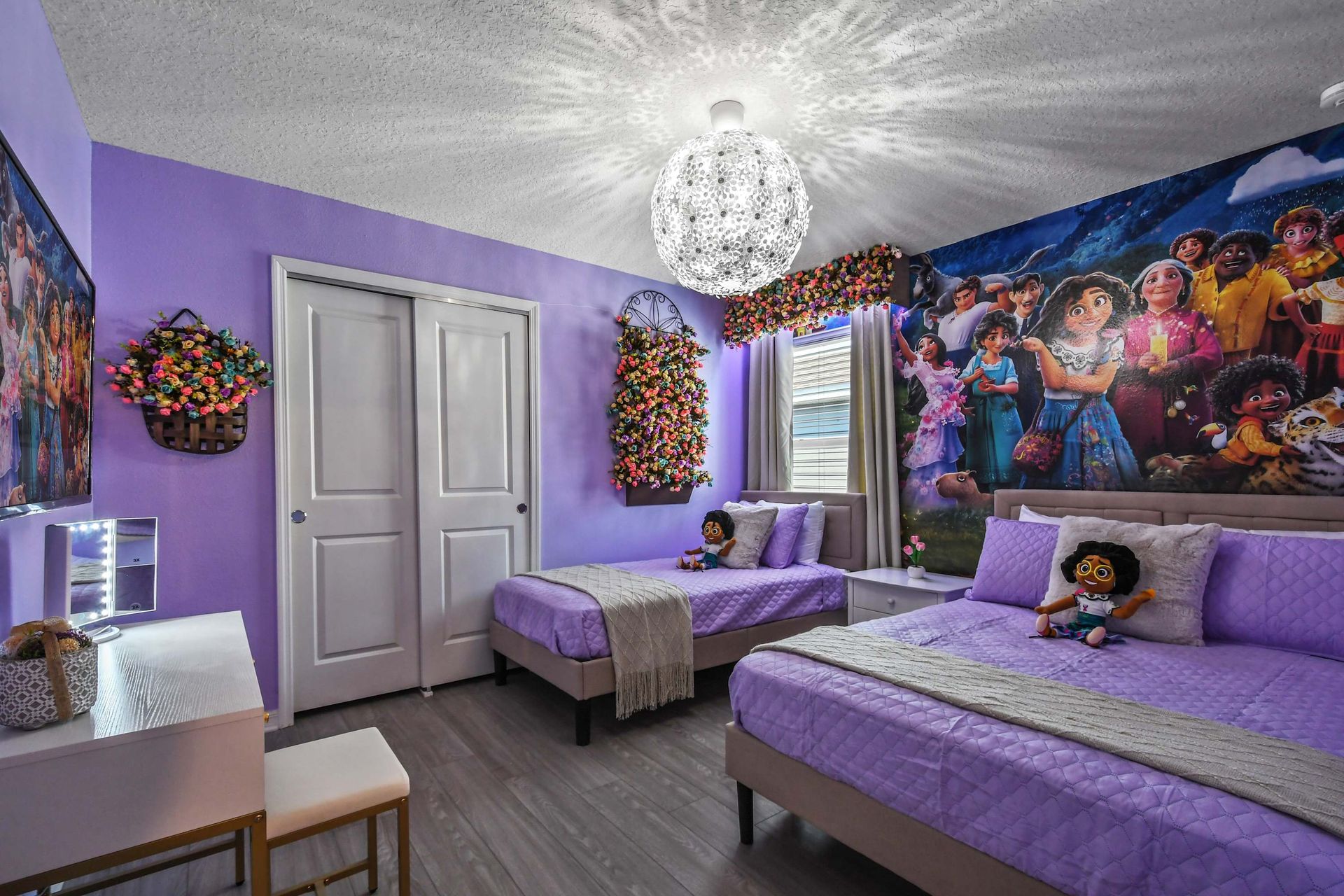 Whimsical lavender room with floral accents and vibrant character-themed wall art.