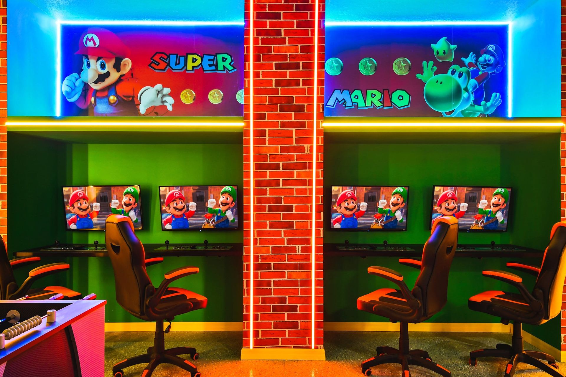 A gamer's paradise, this room is dedicated to Super Mario with themed decor and multiple gaming stations. The bright, colorful setup includes comfortable seating and large displays for an immersive gaming experience.