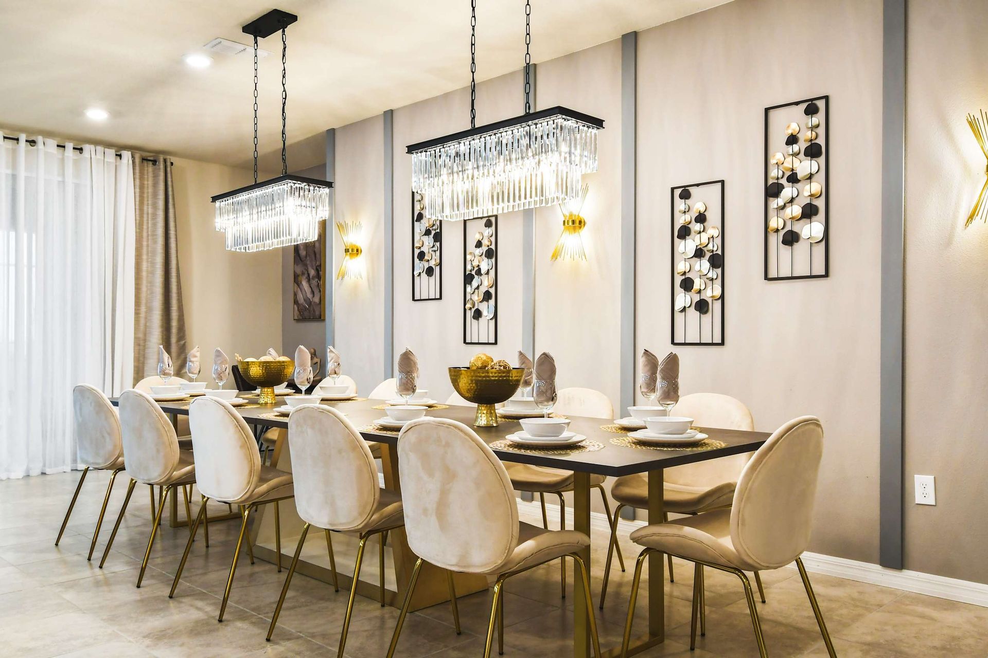 This dining room featuring a long table with 12 seats.