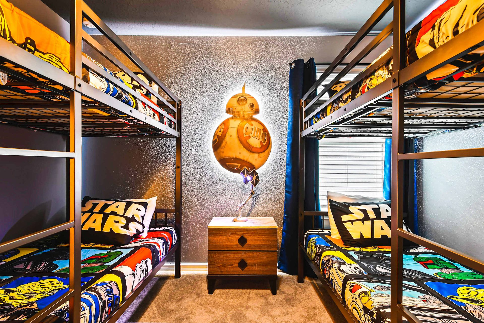 Star Wars-themed bunk room with cozy beds and BB-8 lighting for young Jedis.