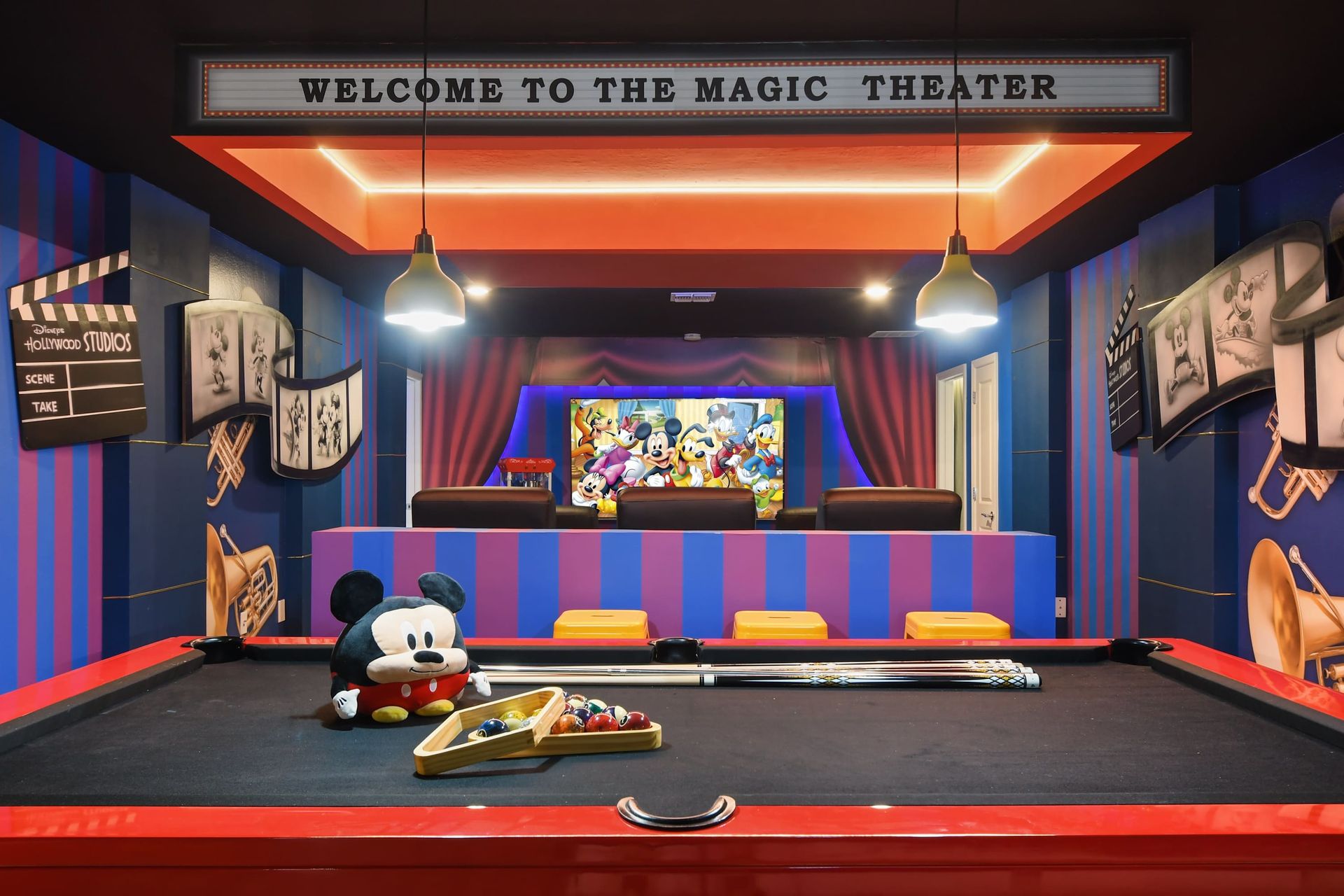 Whimsical Disney theater with pool table, plush seating, and magical cinema vibes.